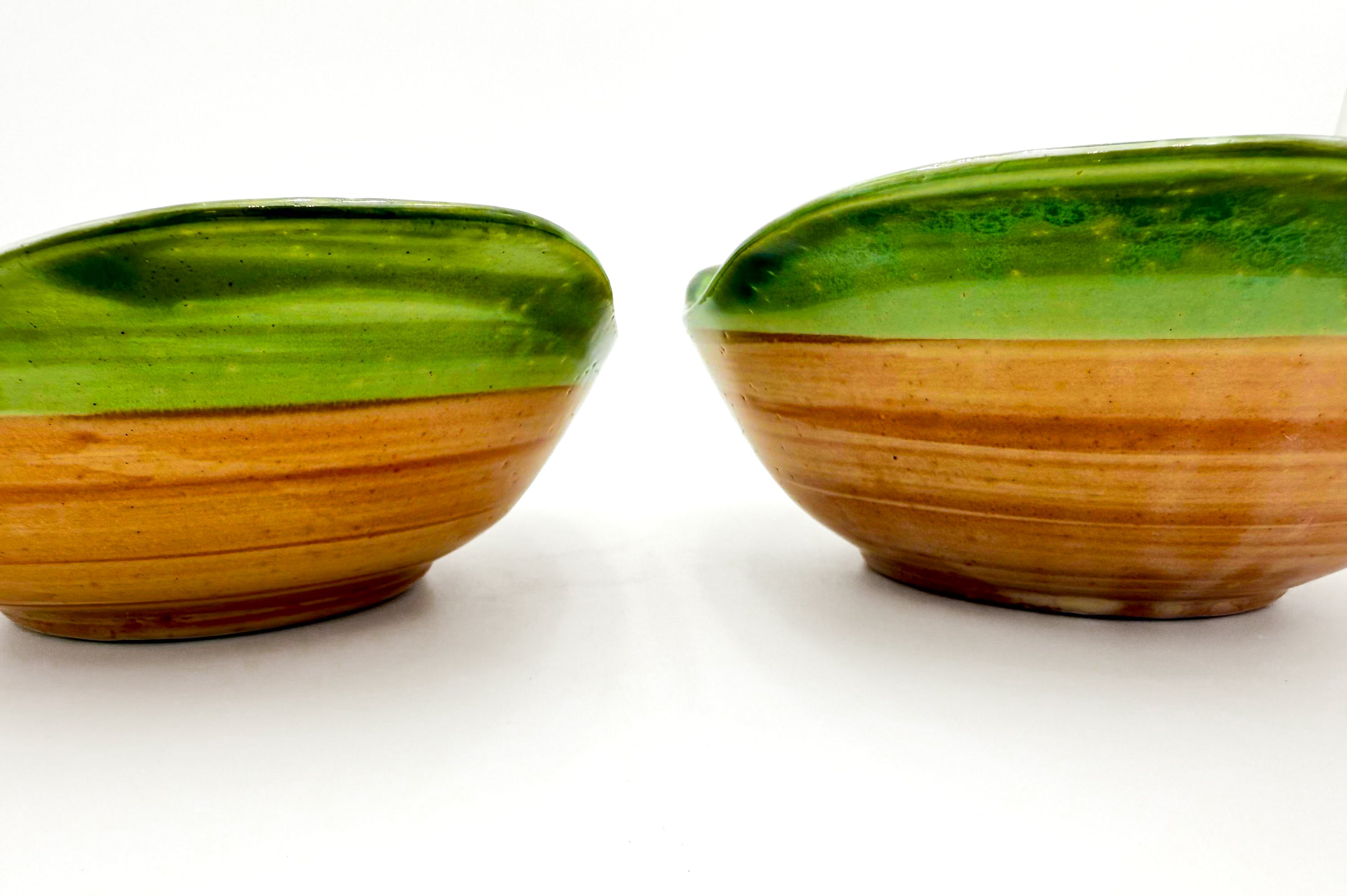 Pair of 1950s John B. Taylor Harvest pattern ceramic mugs in earthy brown and cream glazes.