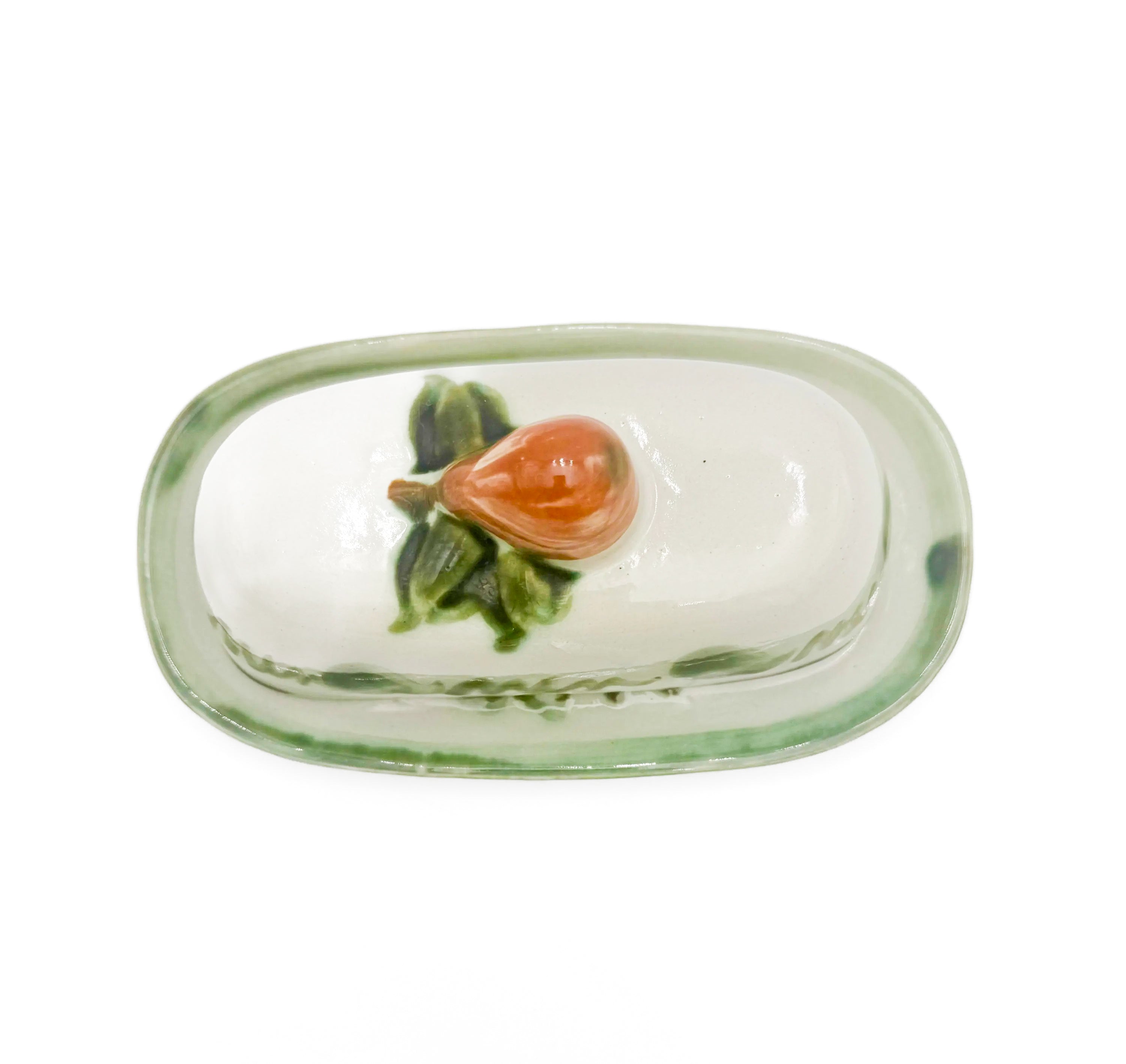 Vintage 1950s John B. Taylor Harvest pattern ceramic covered butter dish with raised fruit motifs.