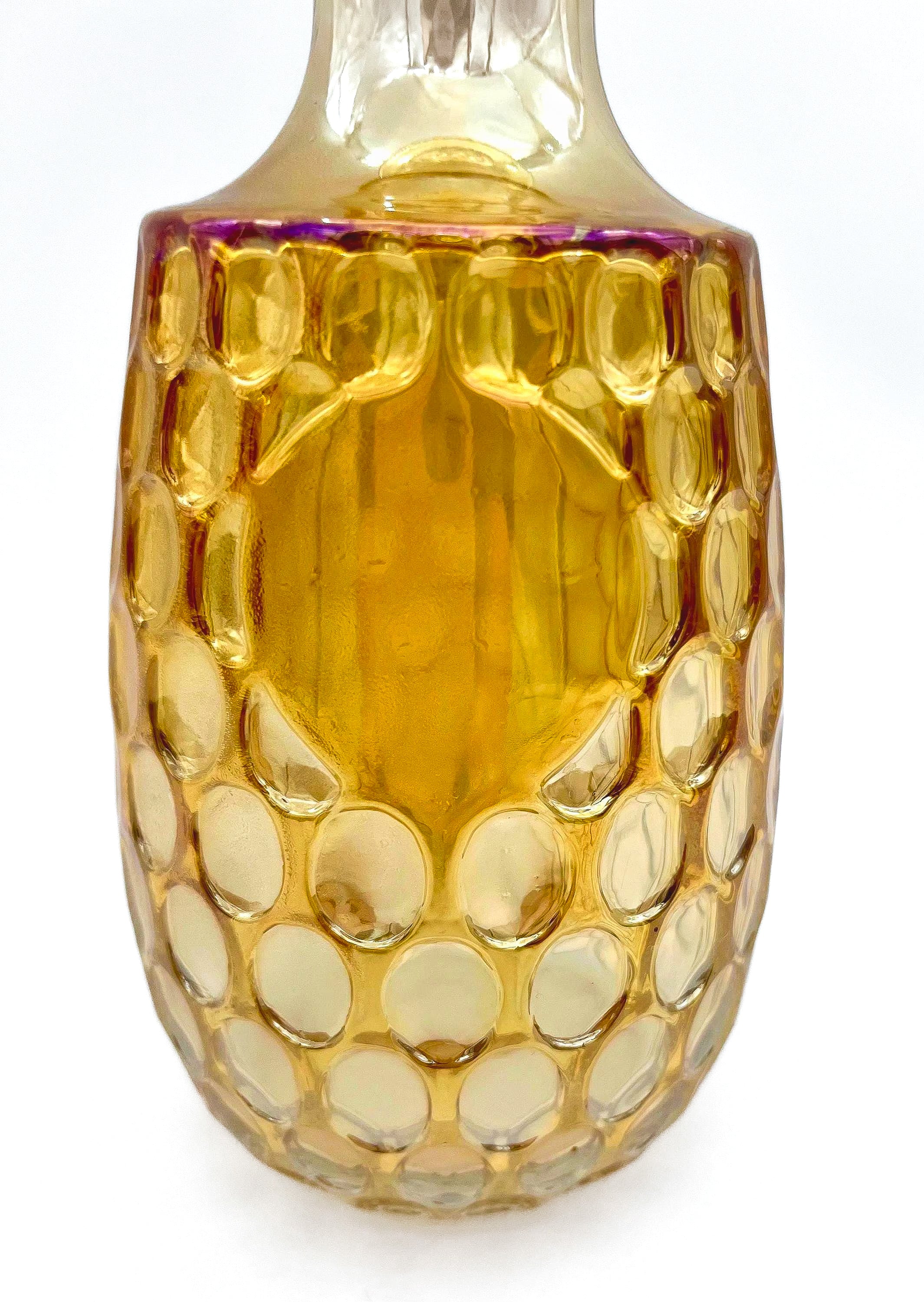Vintage 1960s Old Forester whisky decanter in iridescent carnival glass with a textured geometric pattern.