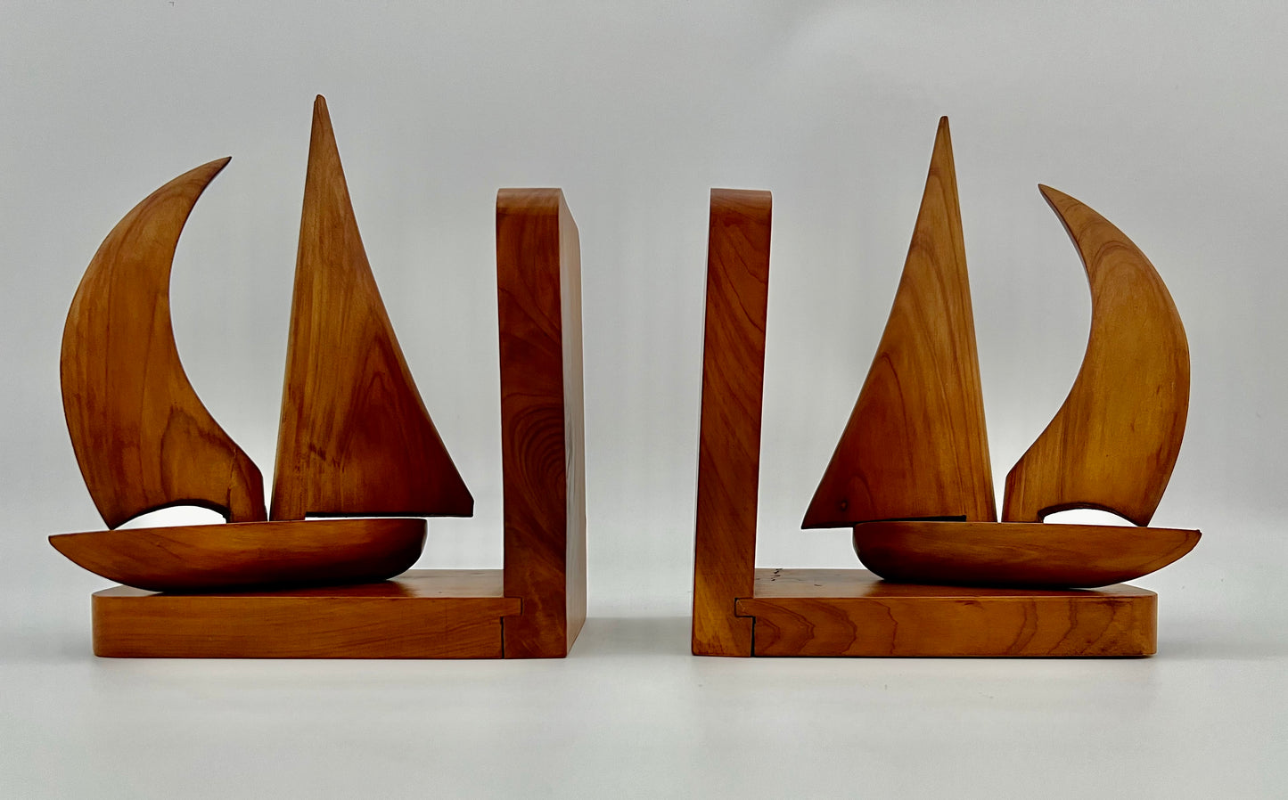 PAIR OF TEAK MIDCENTURY SWIVELING SAILBOAT BOOK ENDS, CIRCA 1965