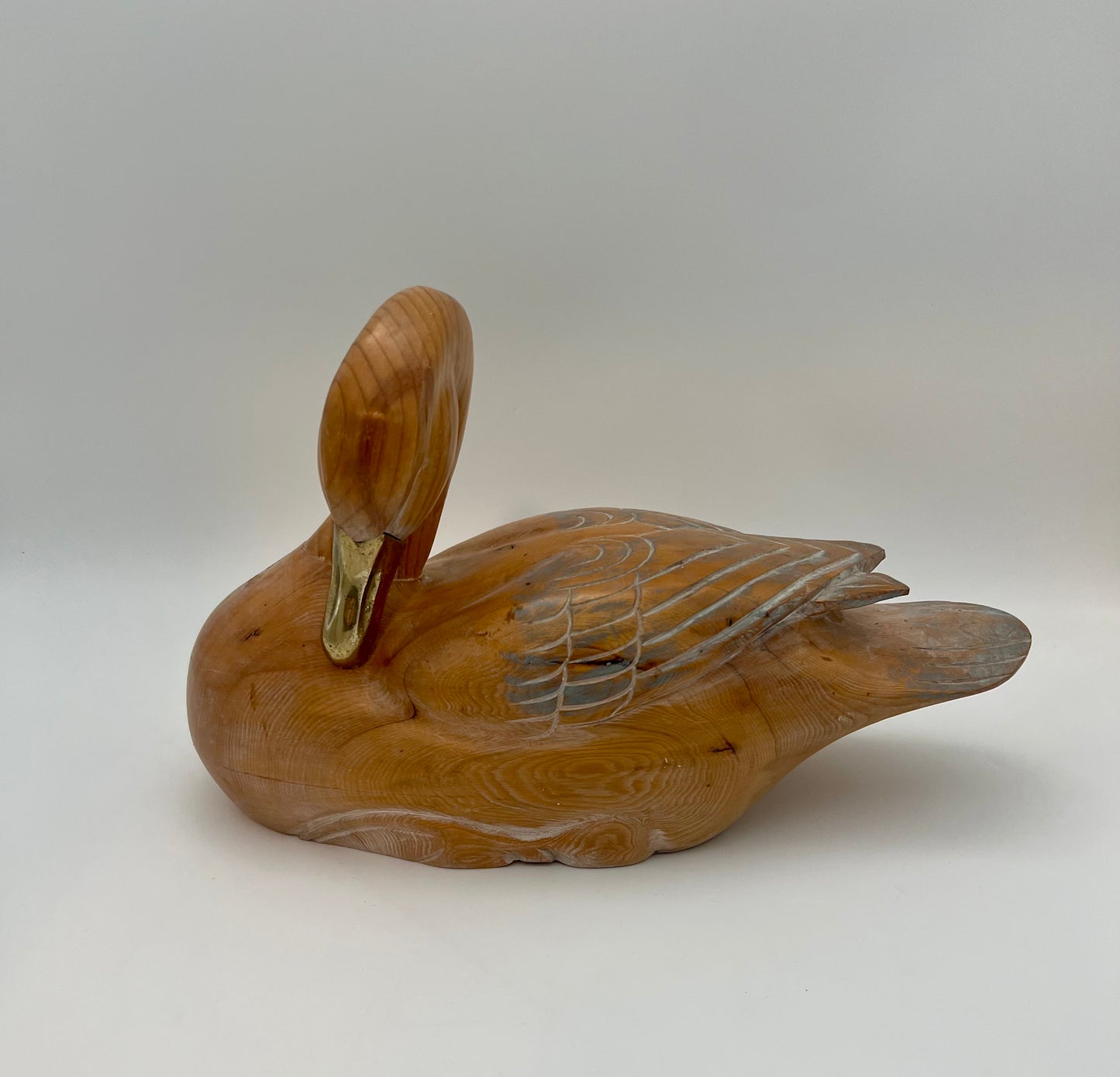 WOOD CARVED SLEEPING DUCK HAND PAINTED WITH BRASS DETAIL