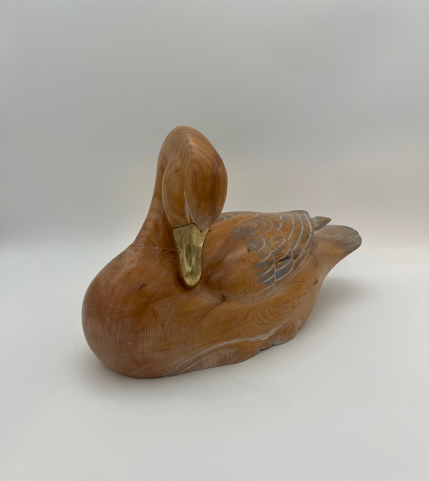 WOOD CARVED SLEEPING DUCK HAND PAINTED WITH BRASS DETAIL