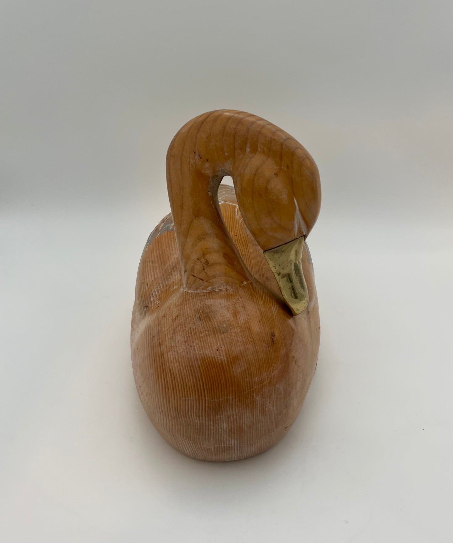 WOOD CARVED SLEEPING DUCK HAND PAINTED WITH BRASS DETAIL
