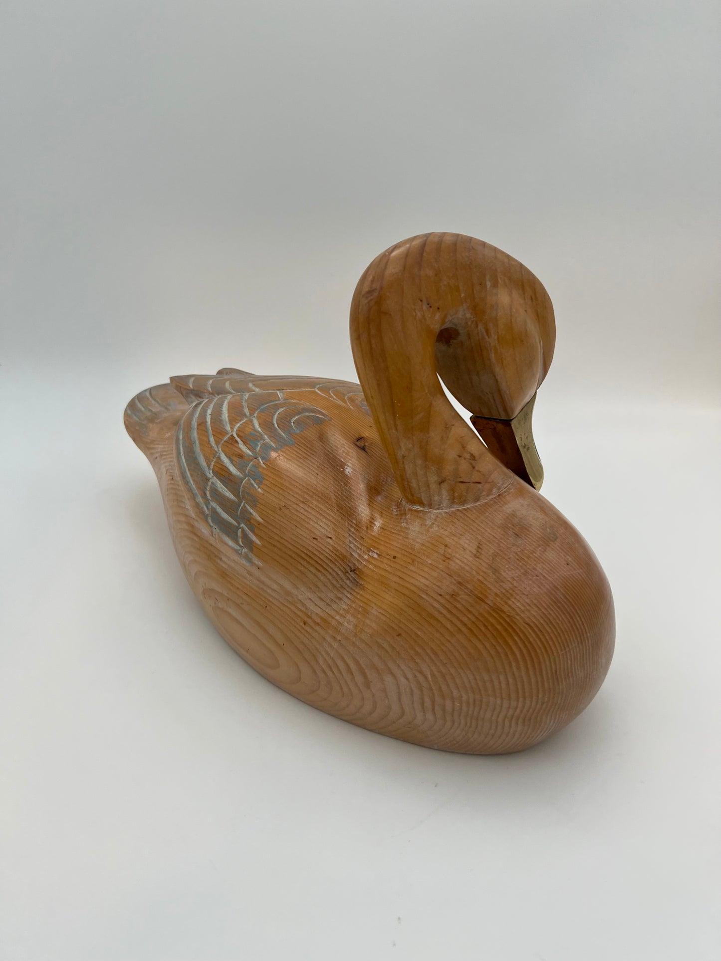 WOOD CARVED SLEEPING DUCK HAND PAINTED WITH BRASS DETAIL