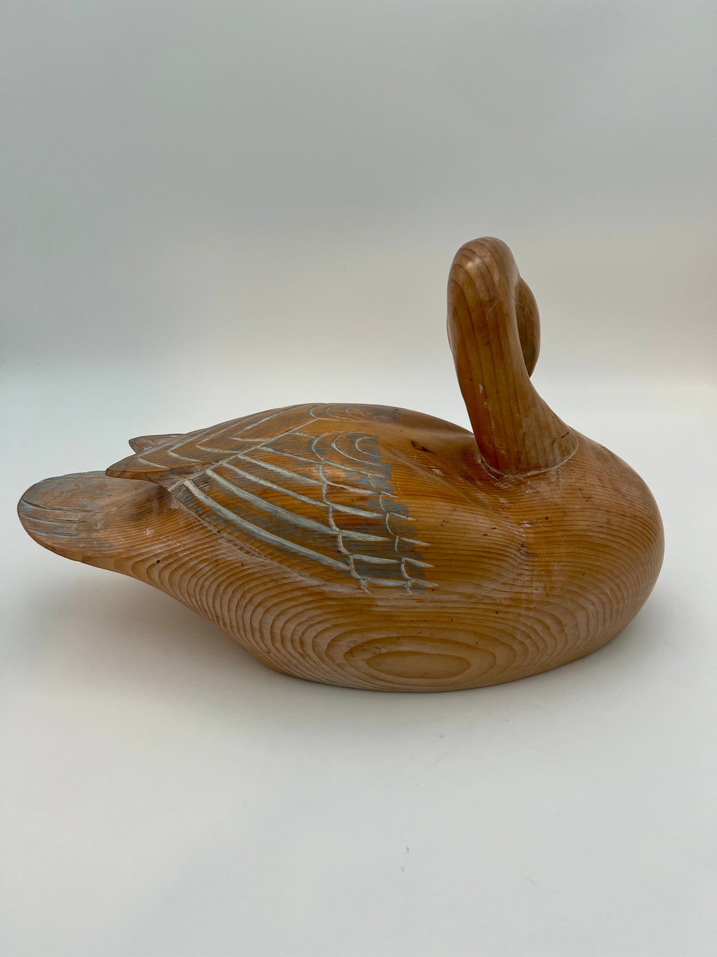 WOOD CARVED SLEEPING DUCK HAND PAINTED WITH BRASS DETAIL