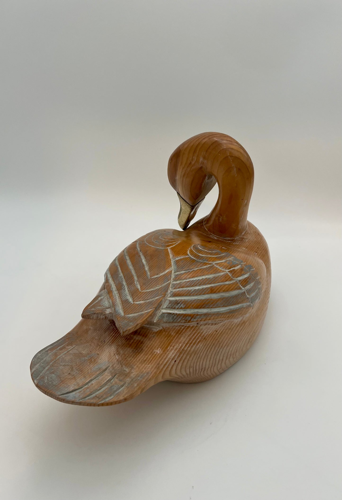 WOOD CARVED SLEEPING DUCK HAND PAINTED WITH BRASS DETAIL