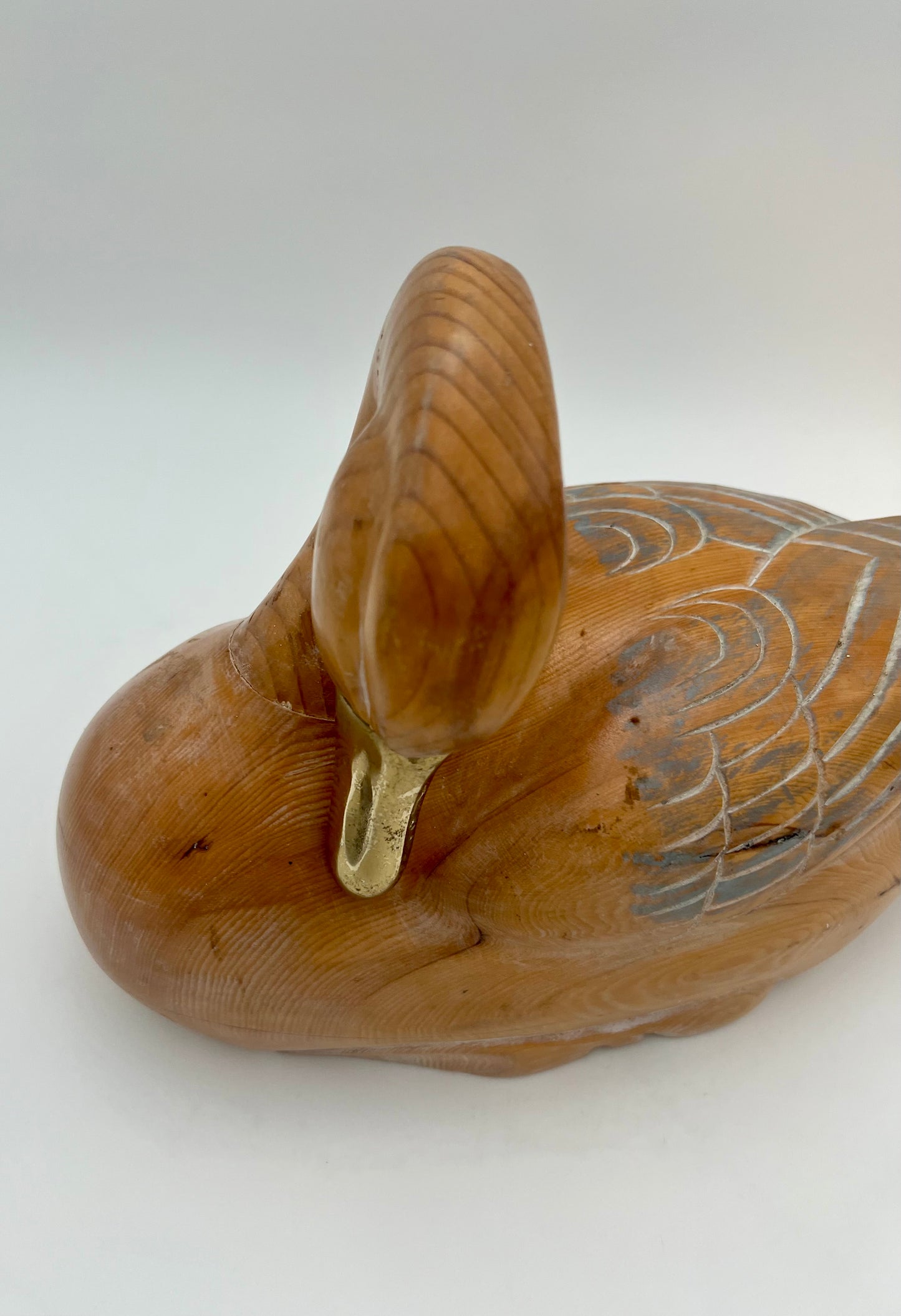 WOOD CARVED SLEEPING DUCK HAND PAINTED WITH BRASS DETAIL