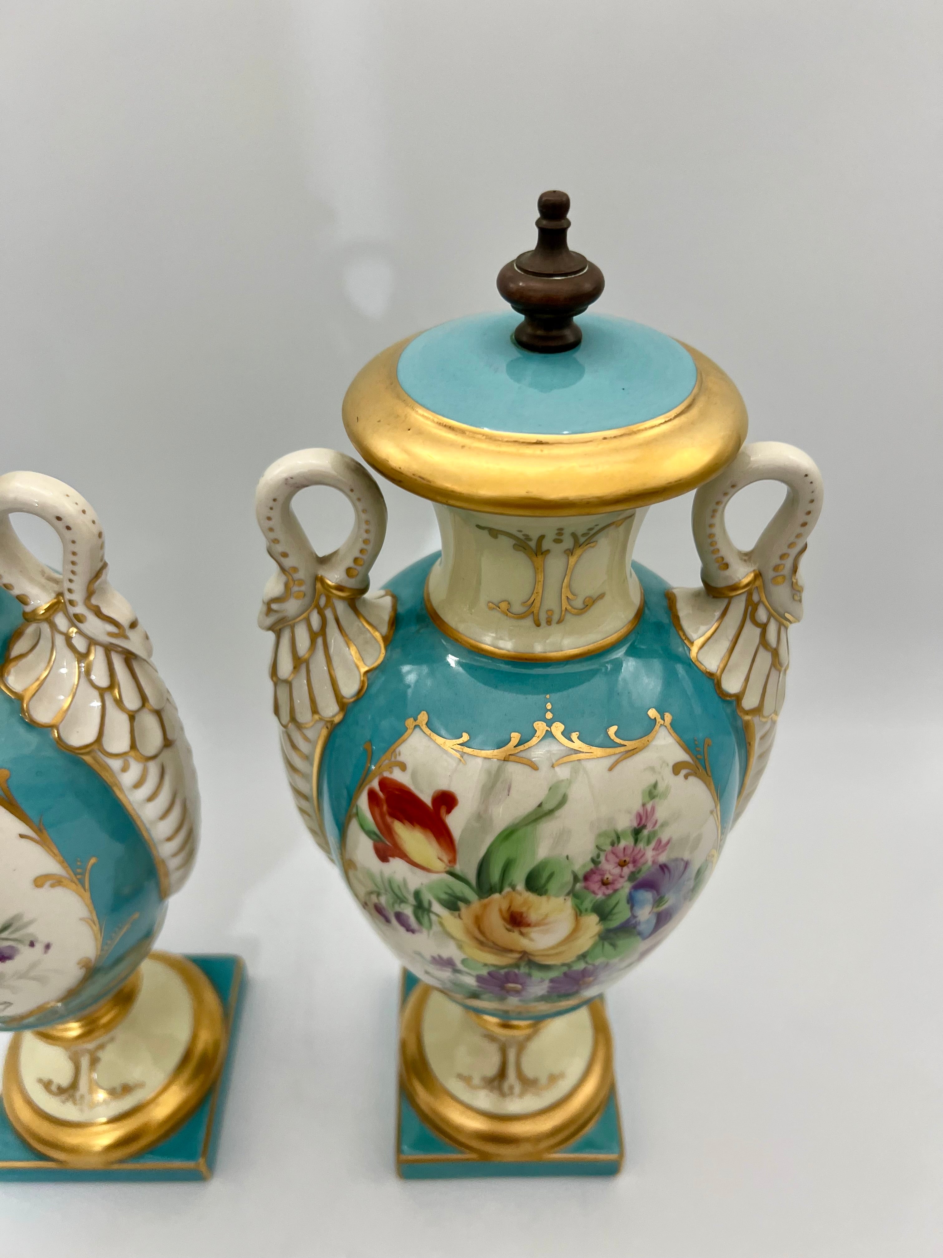 PAIR OF 19TH CENTURY LIMOGES SWAN-HANDLE URN VASES WITH LIDS – TURQUOISE & GOLD OLD PARIS STYLE, HAND-PAINTED FLORAL CARTOUCHES