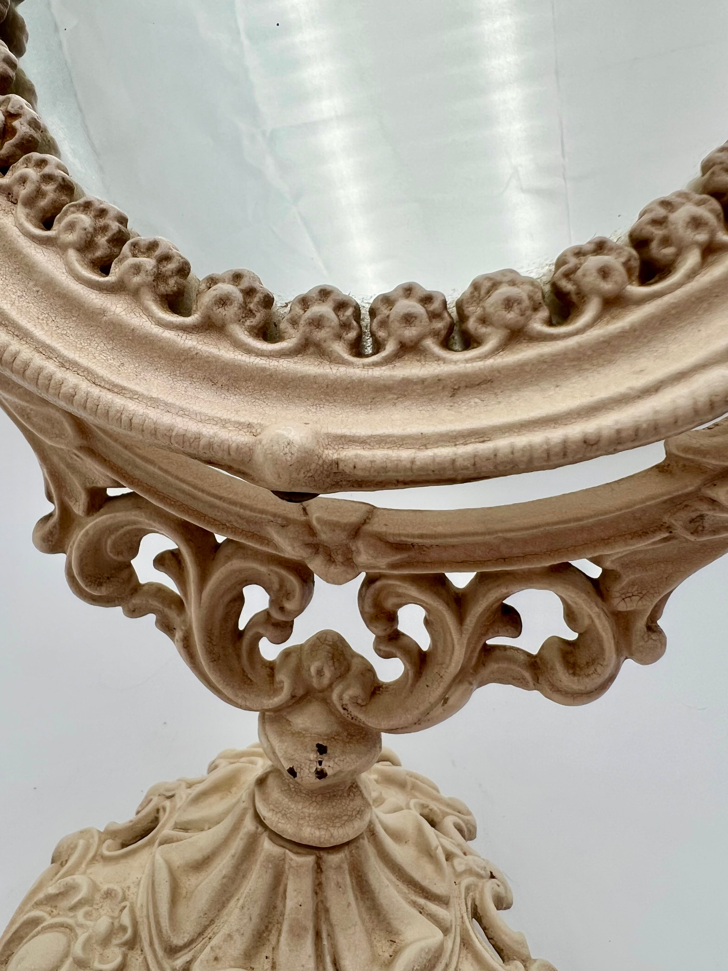 ANTIQUE VANITY TABLE MIRROR WITH DOG HEAD HANDLES & PUTTO CHERUB – ORNATE CAST IRON – 14 ¾ INCH – CIRCA EARLY 1900s