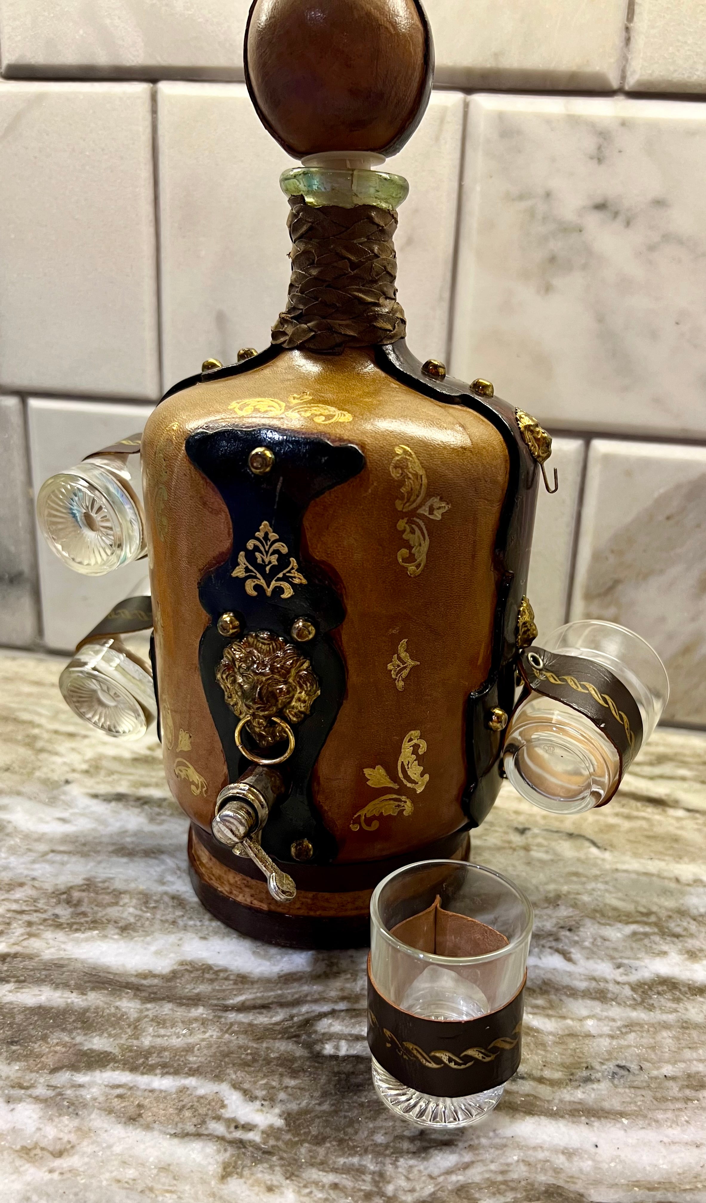 VINTAGE ITALIAN LEATHER-WRAPPED DECANTER SET WITH LION SPIGOT