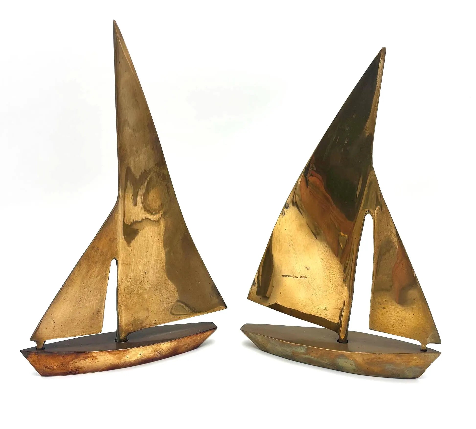 VINTAGE SOLID BRASS SAILBOAT SCULPTURES – COLLECTION OF FOUR MODERNIST YACHTS