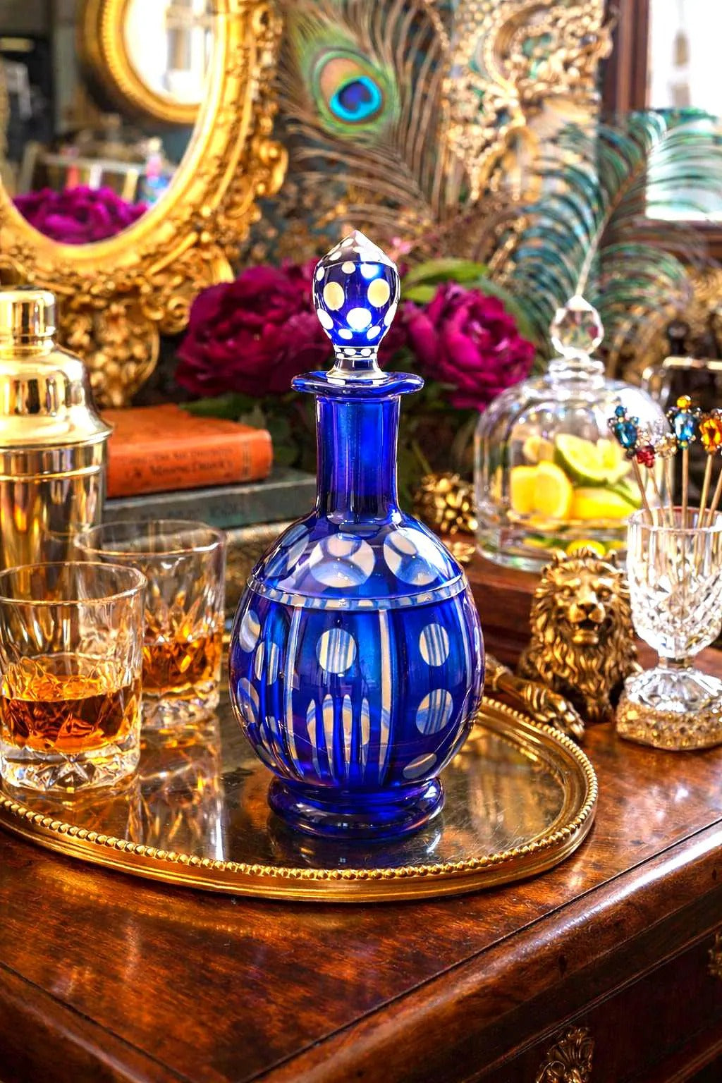 Minimalist mid-century modern decanter in a deep cobalt blue glass with a matching round stopper.