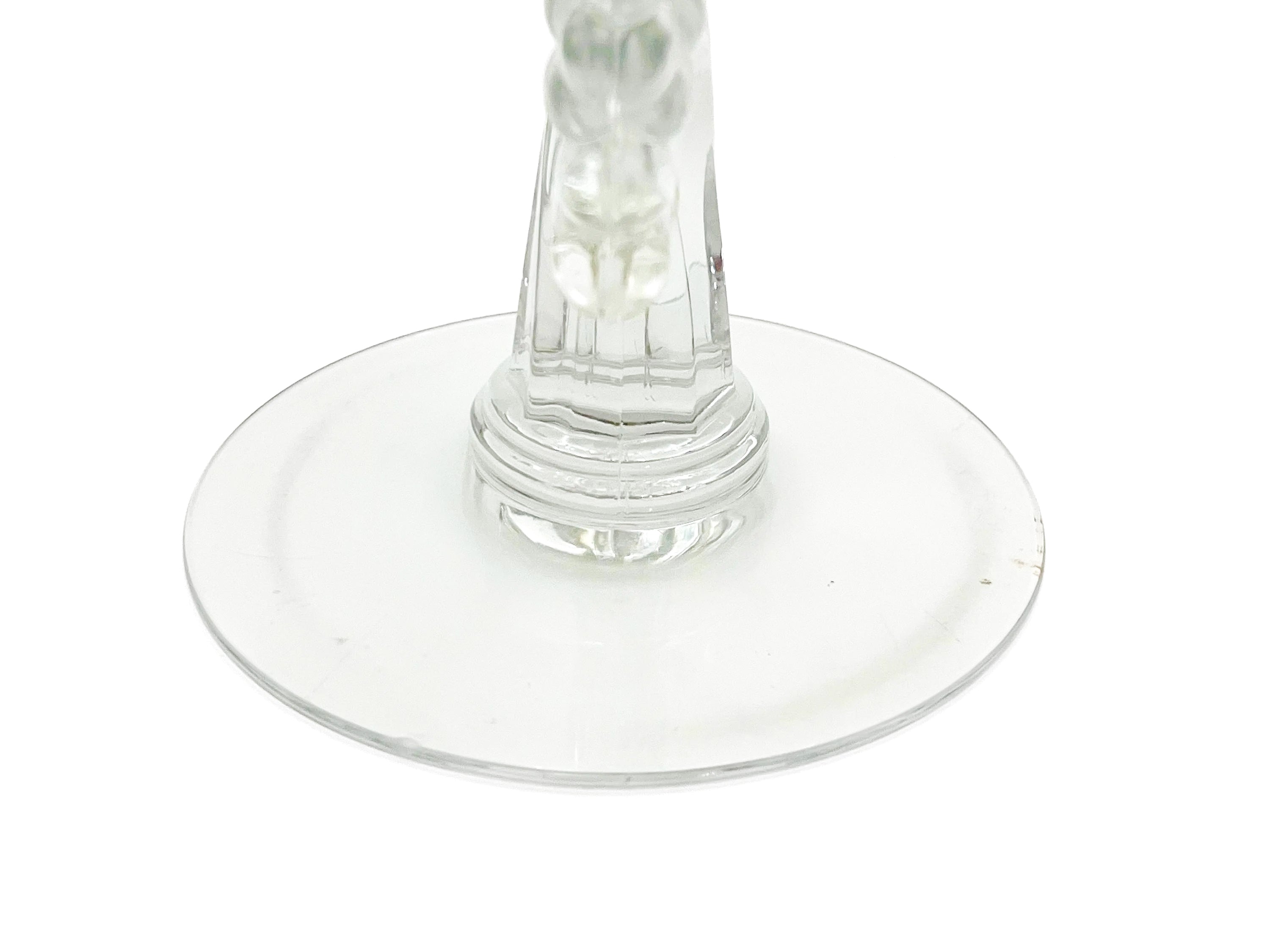 Pair of 1930s Heisey glass candelabras featuring rare molded grape cluster designs and elegant glass arms.