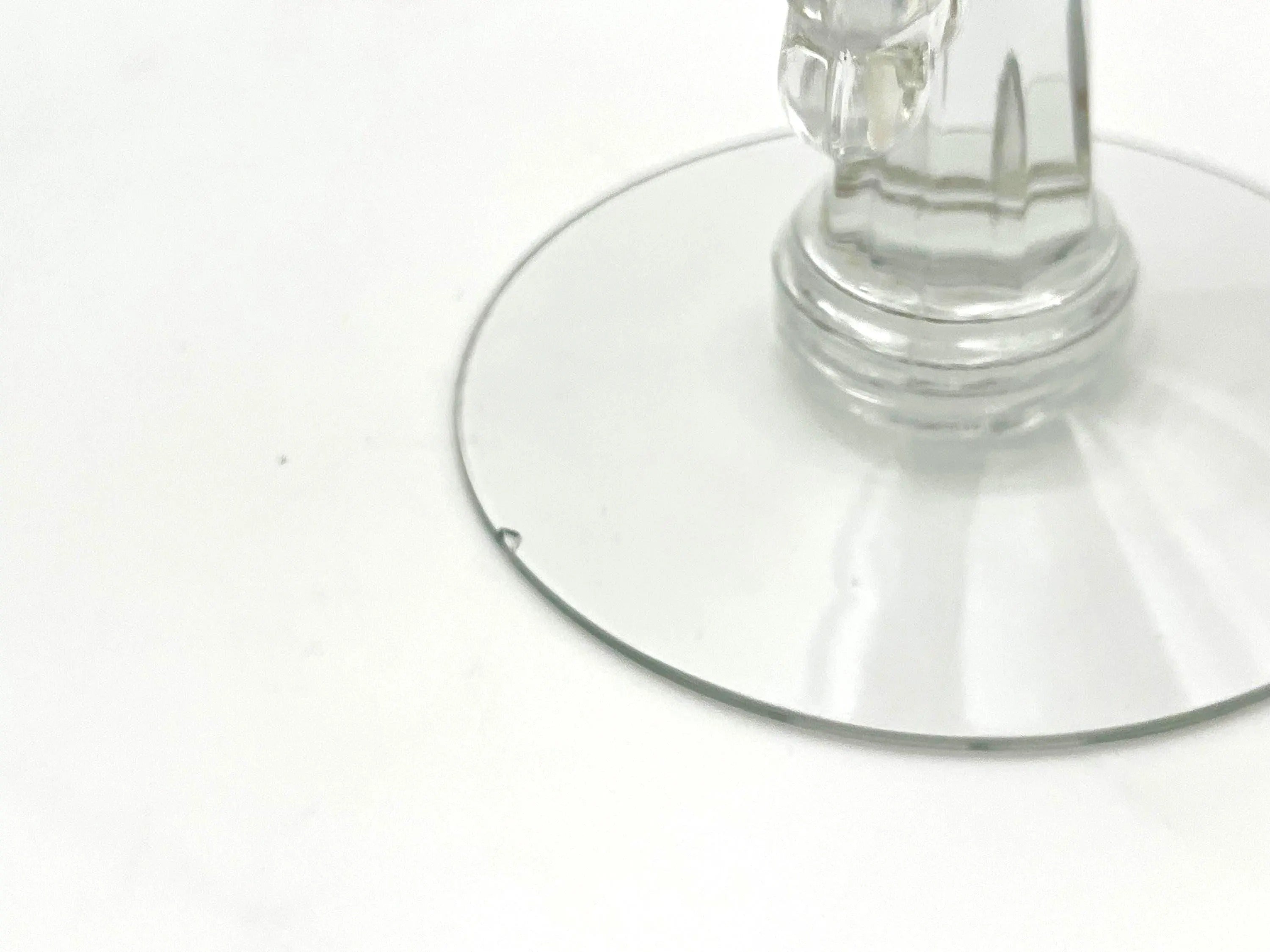 Pair of 1930s Heisey glass candelabras featuring rare molded grape cluster designs and elegant glass arms.