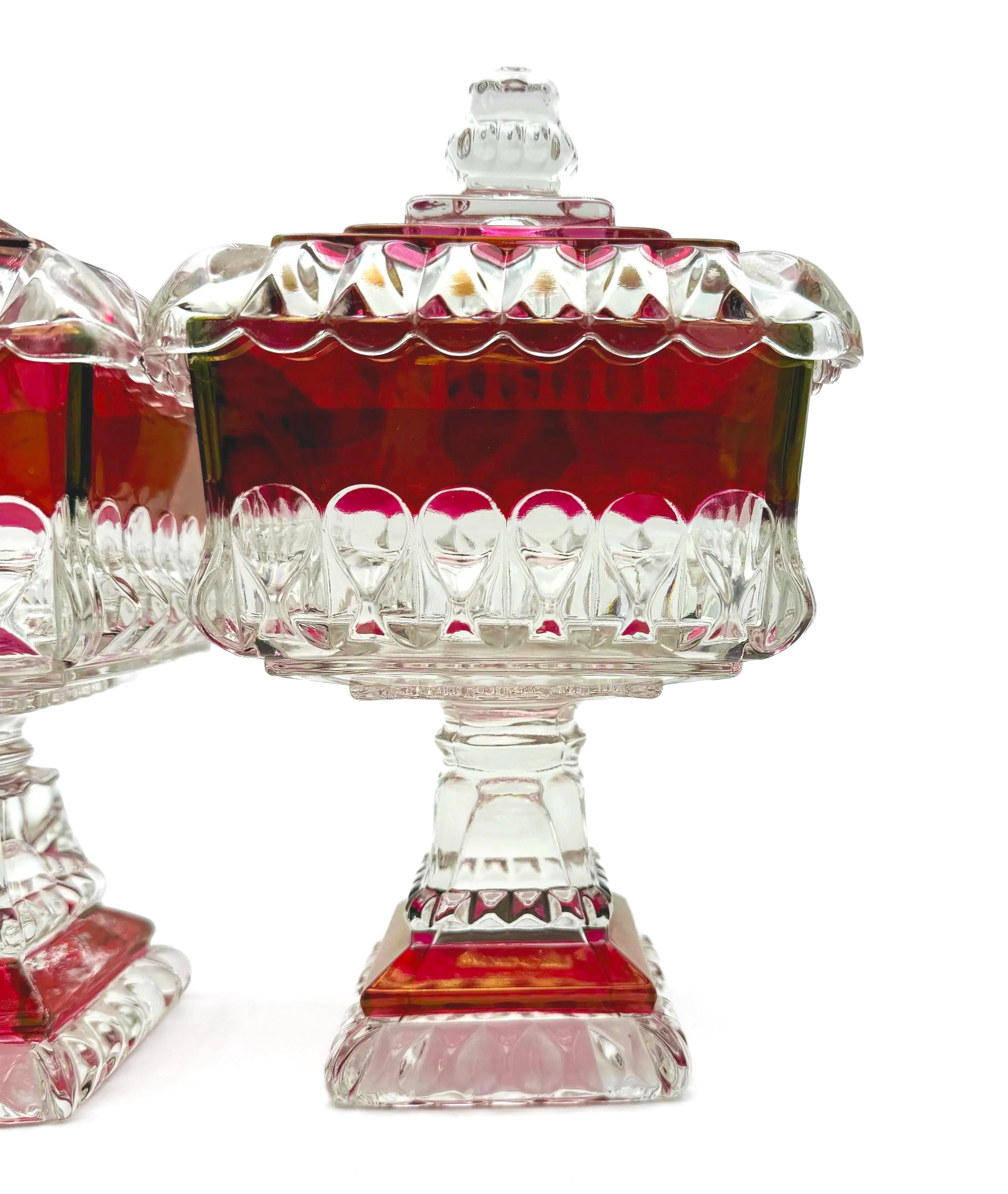 1890s Victorian ruby-stained EAPG pedestal compotes with lids, manufactured by U.S. Glass.