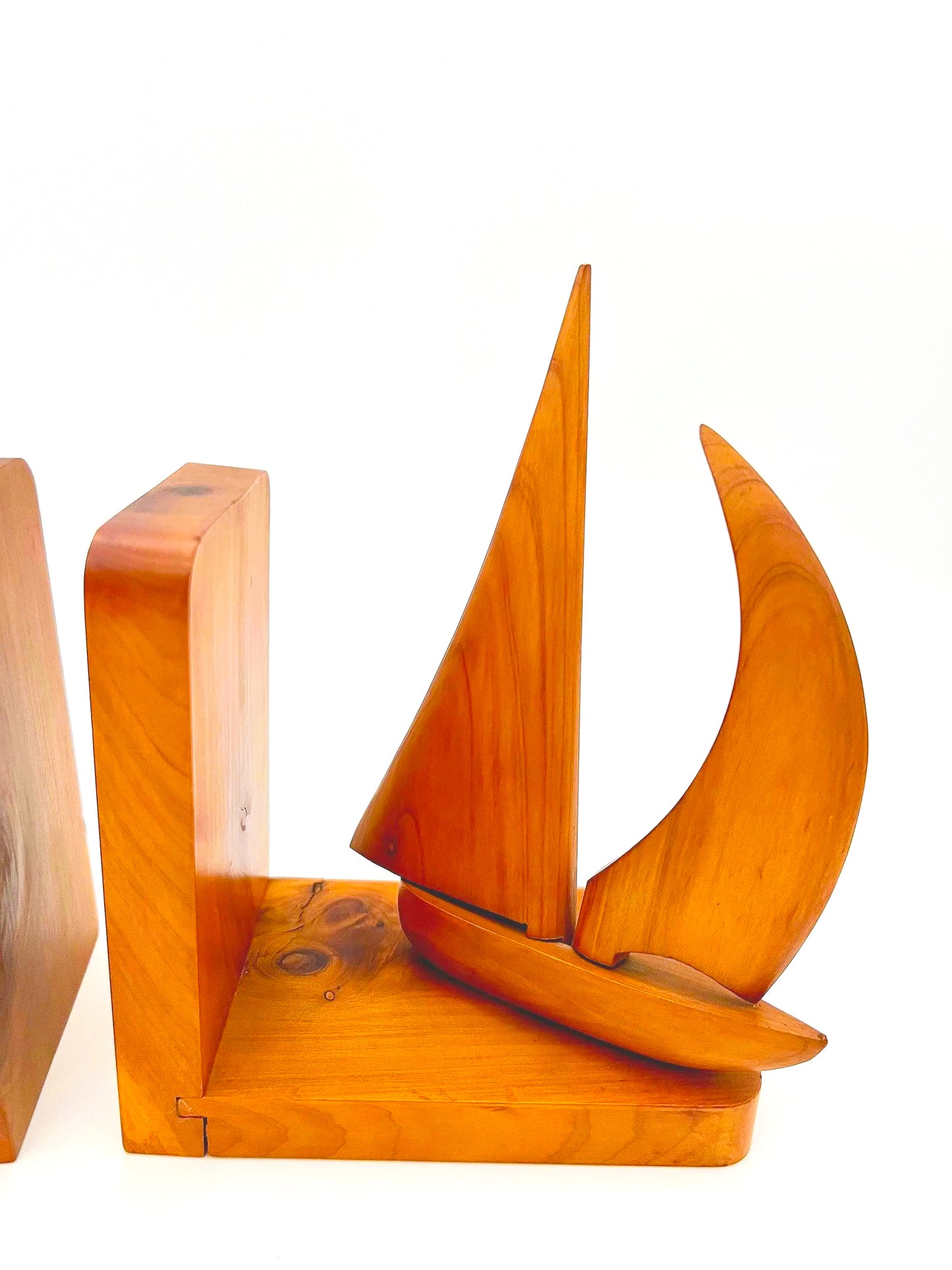 Pair of 1965 mid-century modern teak wood bookends carved in the shape of sailboats.
