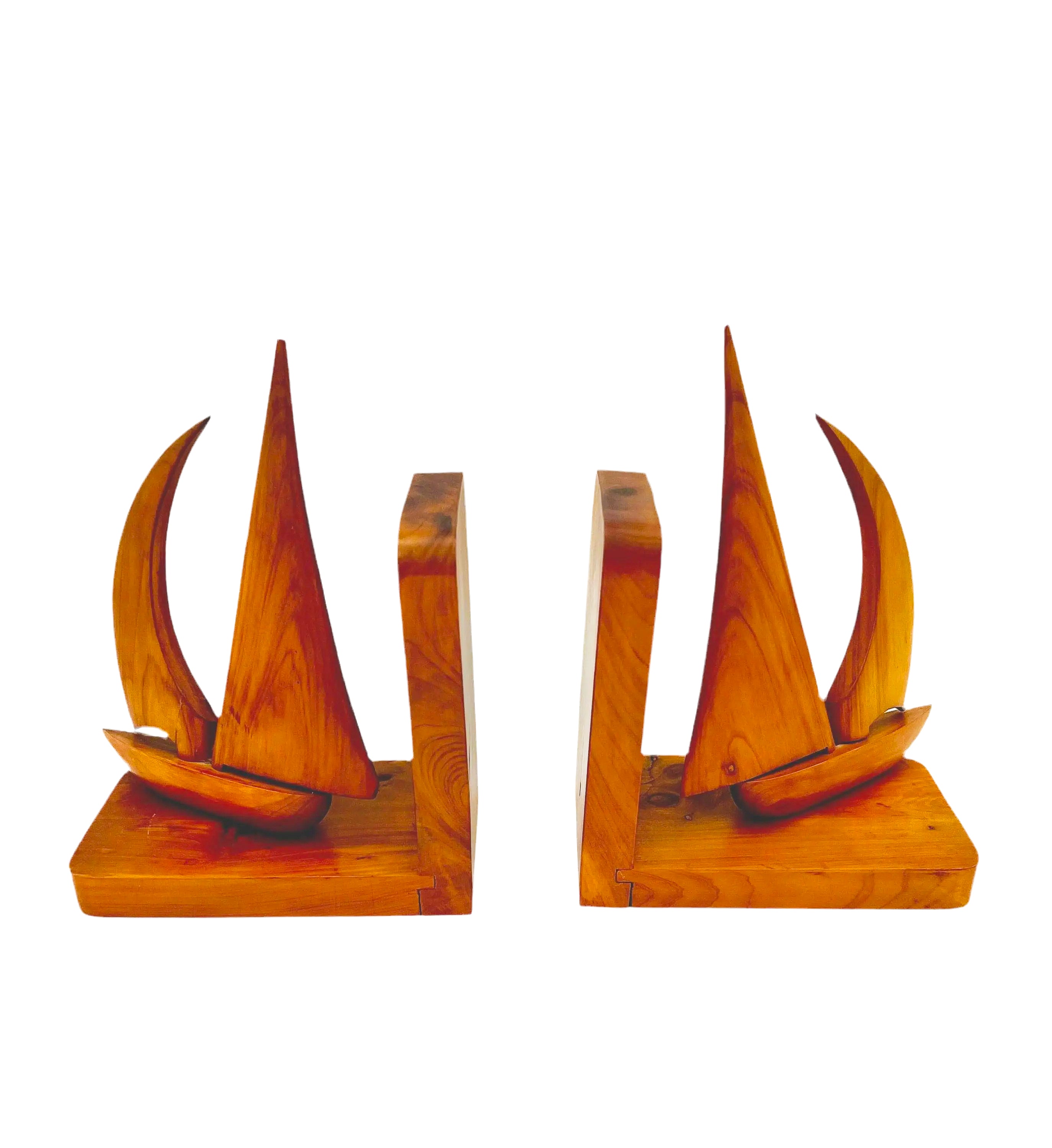Pair of 1965 mid-century modern teak wood bookends carved in the shape of sailboats.