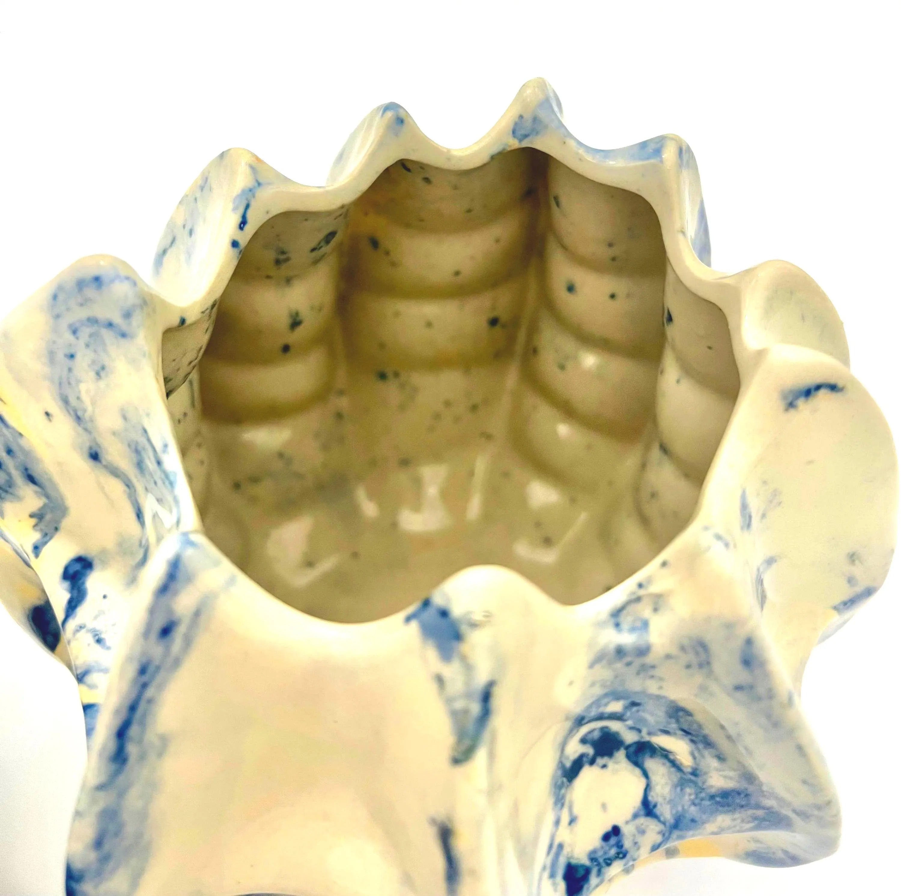 Pair of vintage ceramic planters or candle holders with an abstract blue and white splatter-ware pattern.