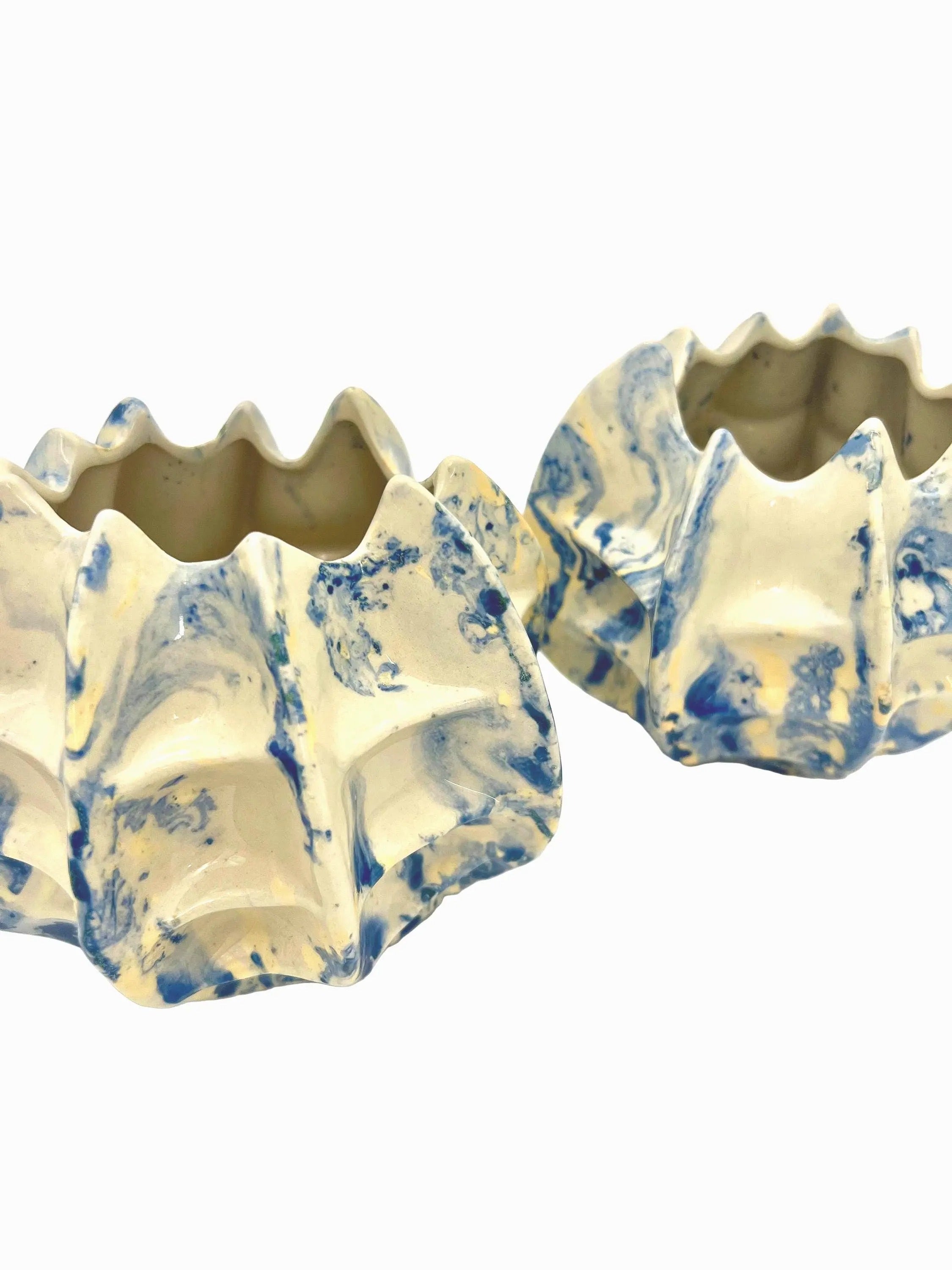 Pair of vintage ceramic planters or candle holders with an abstract blue and white splatter-ware pattern.