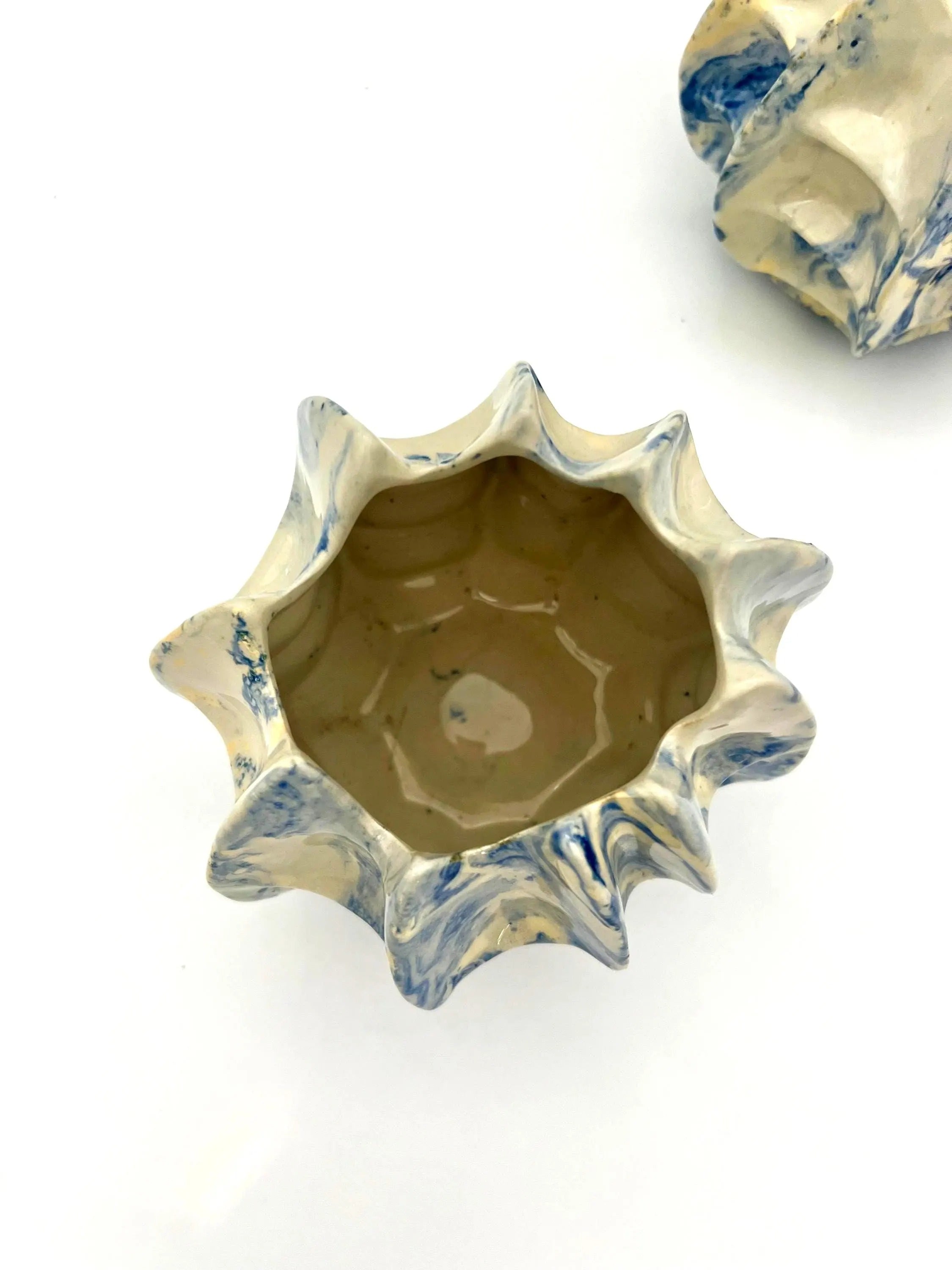 Pair of vintage ceramic planters or candle holders with an abstract blue and white splatter-ware pattern.