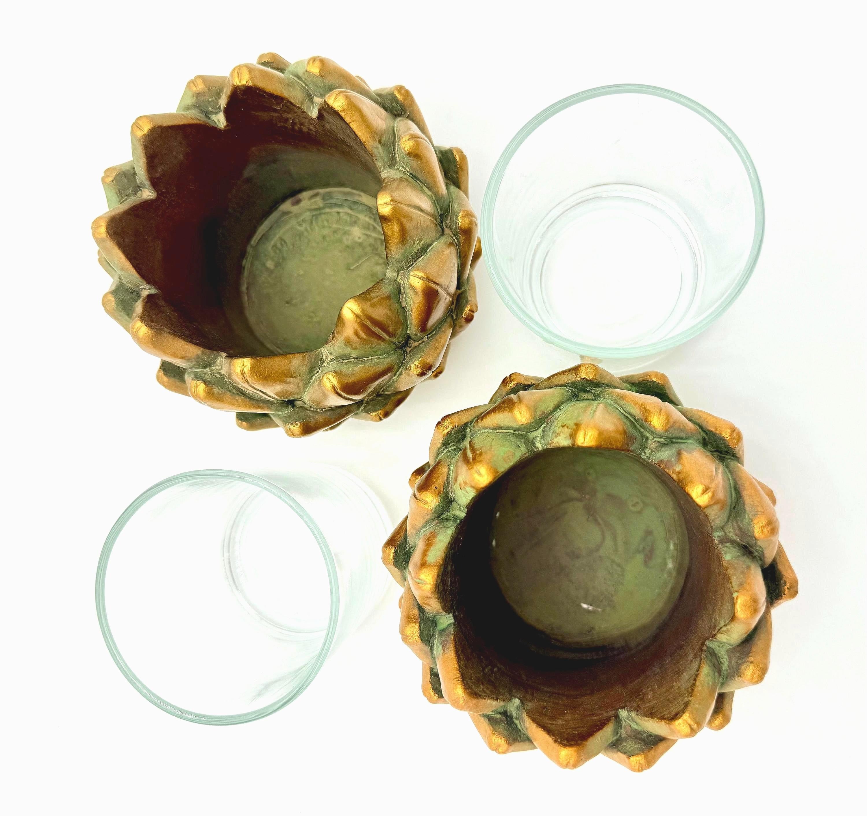 Pair of heavy vintage votive holders shaped like golden artichokes with a metallic finish.
