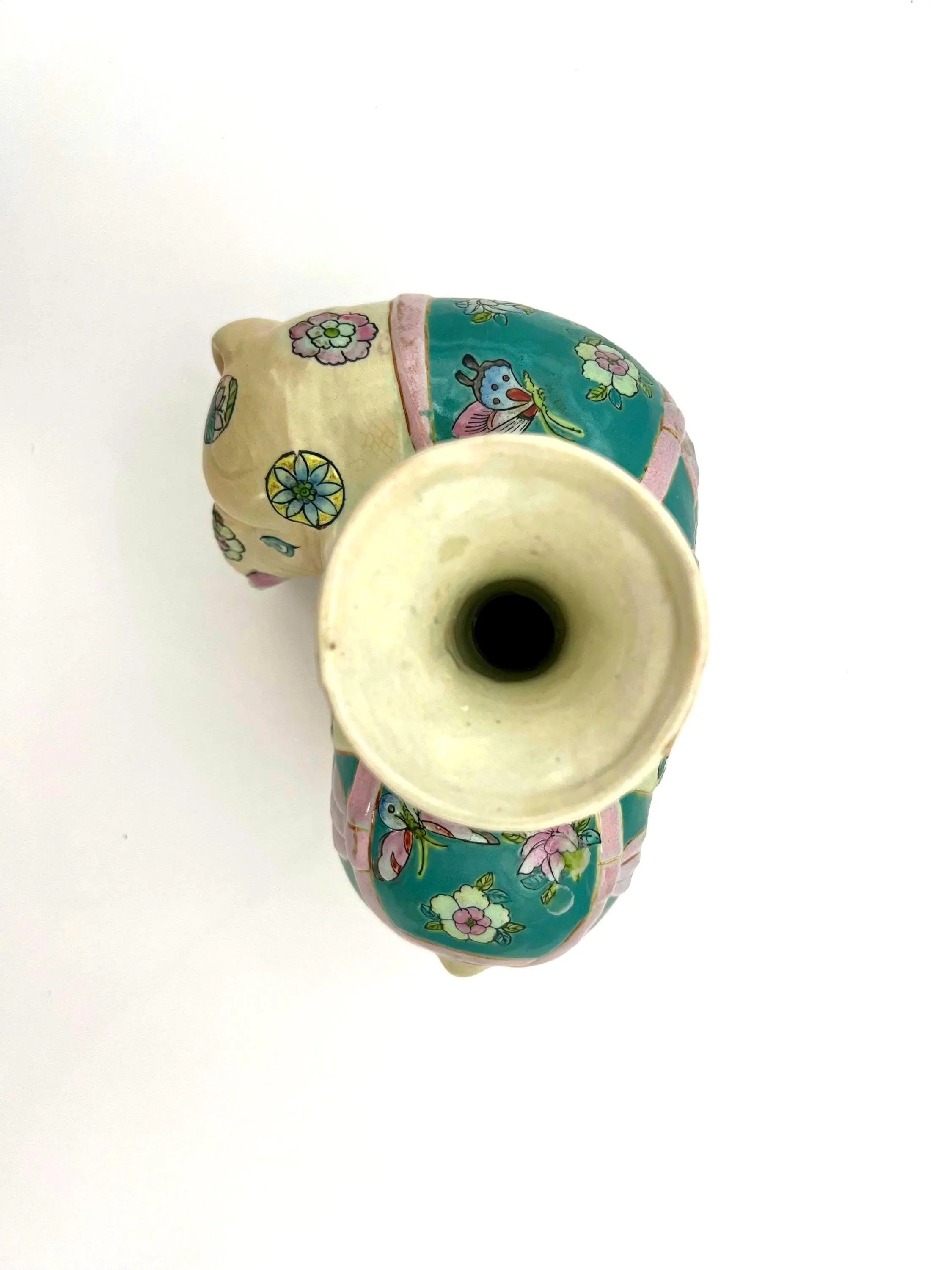 Hand-painted antique Chinese porcelain elephant candleholder with an ornate saddle and floral motifs.