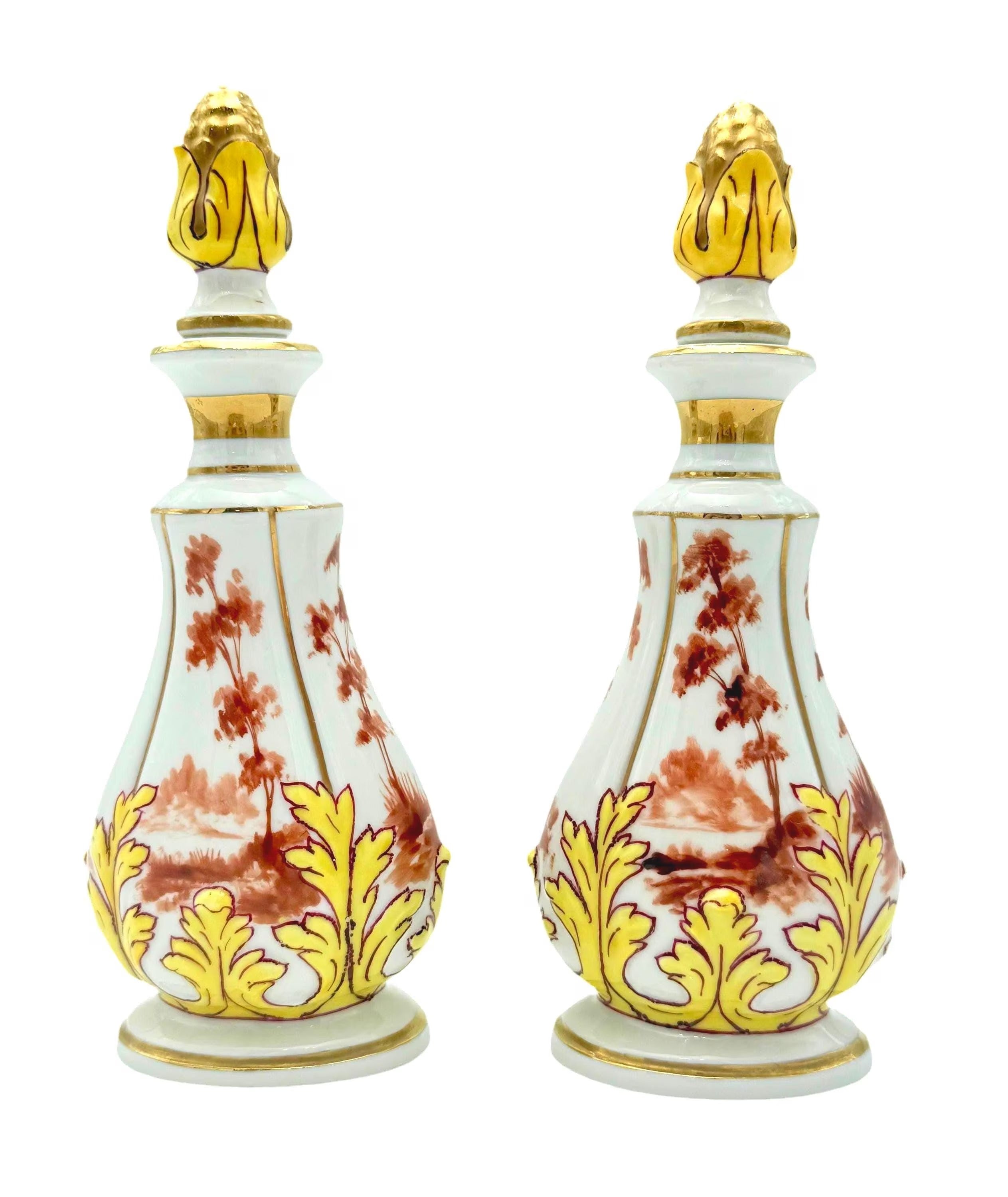 Pair of 19th-century French porcelain cologne bottles with intricate hand-painted Victorian scenes.