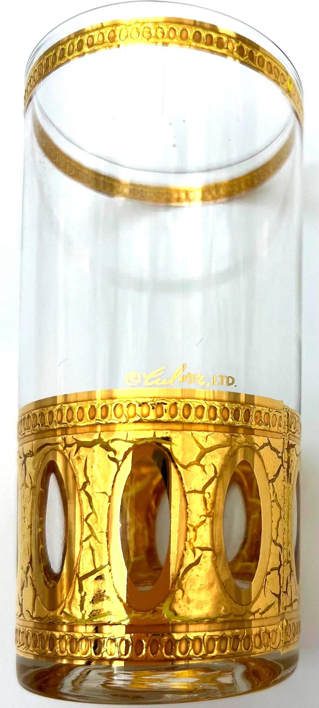 Set of 8 signed vintage Culver highball glasses featuring an intricate 22k gold geometric pattern.