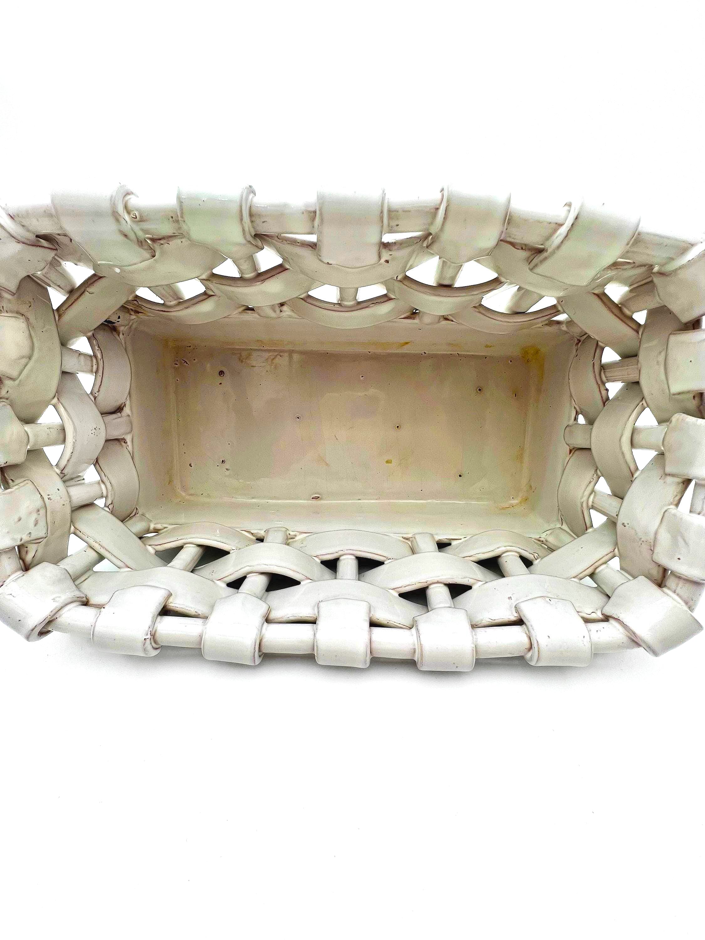 Italian glazed terra cotta decorative basket with a realistic ceramic woven texture.