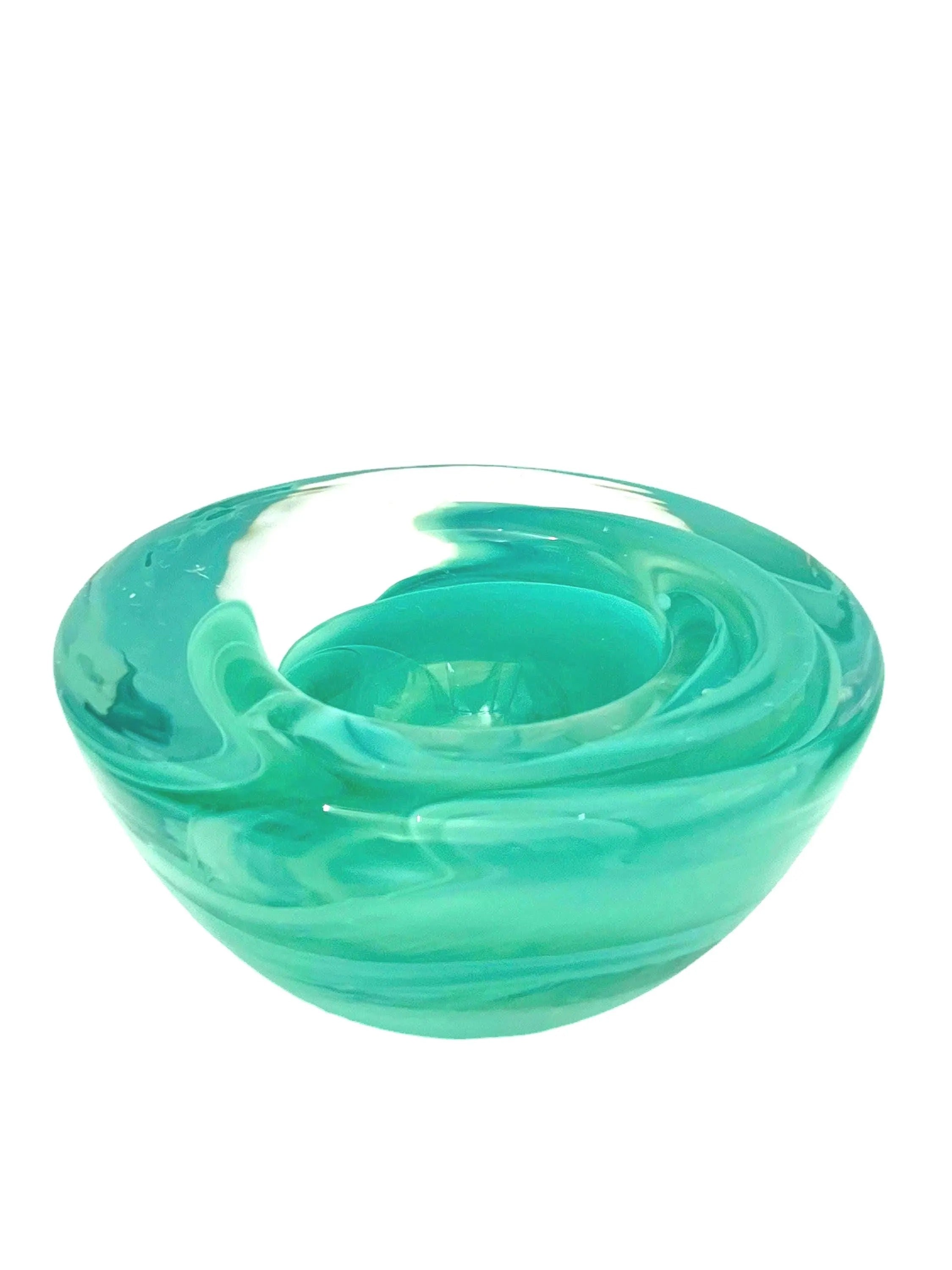 Vintage mouth-blown Kosta Boda glass tea light holder in a translucent teal color.