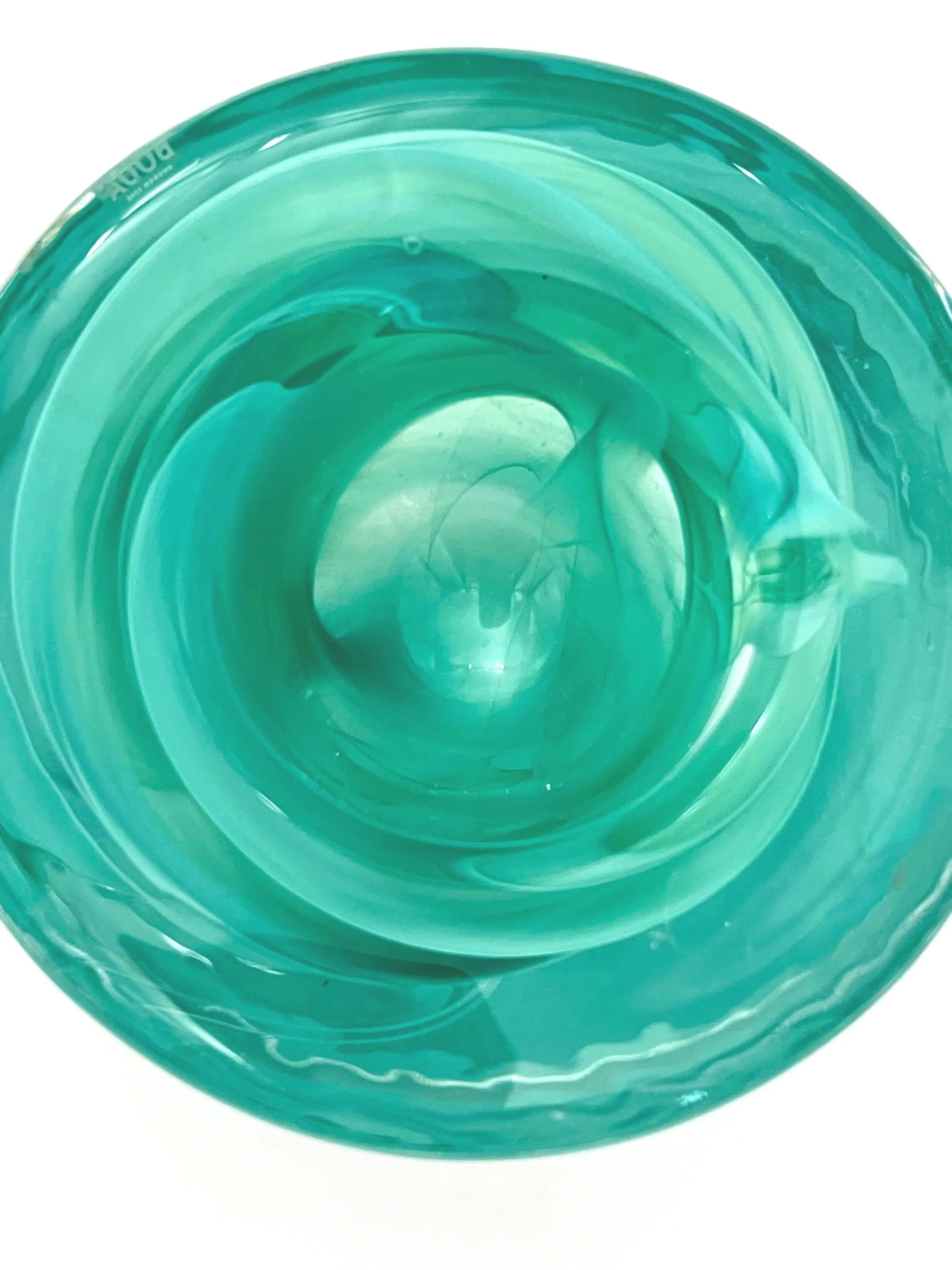 Vintage mouth-blown Kosta Boda glass tea light holder in a translucent teal color.