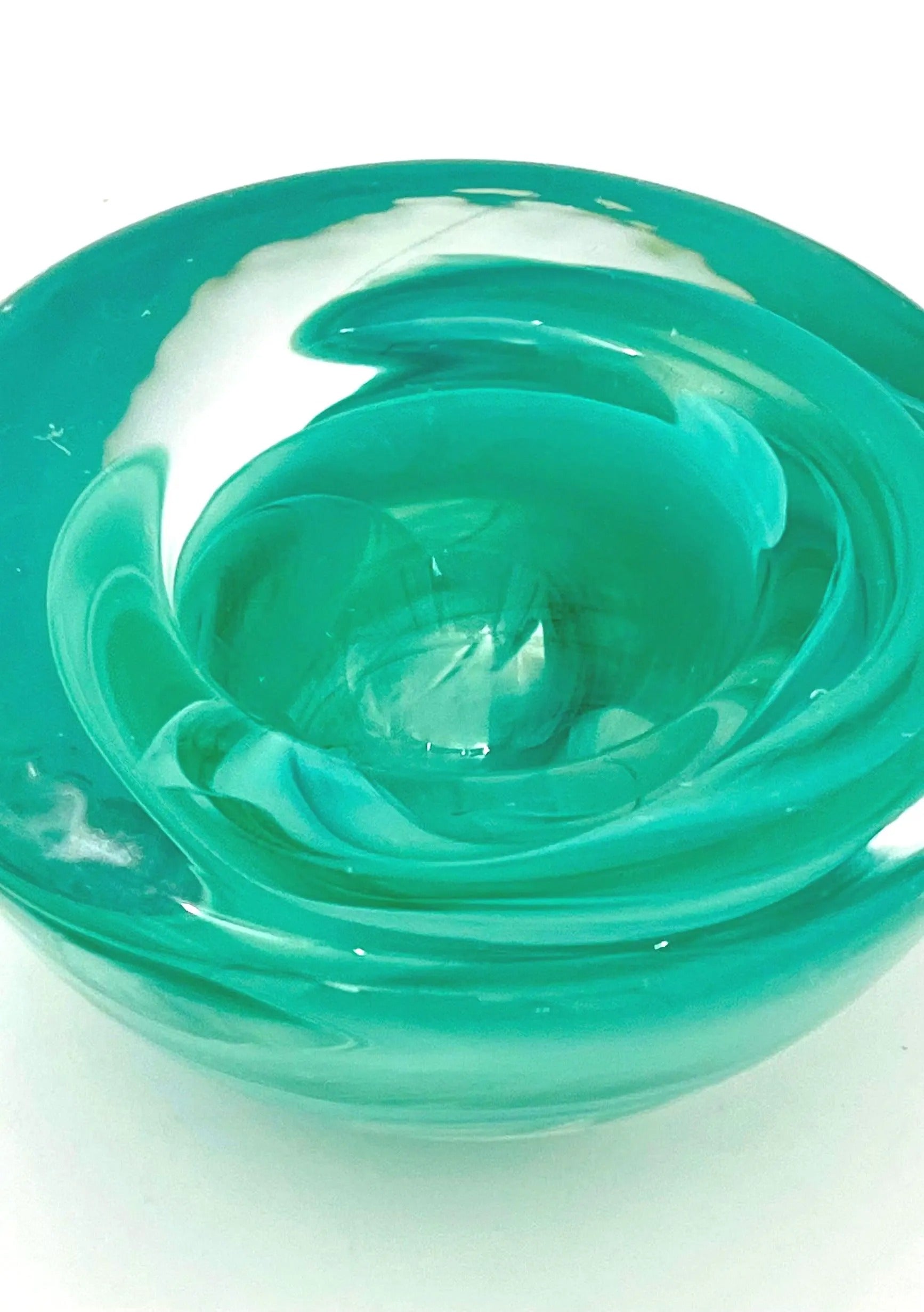 Vintage mouth-blown Kosta Boda glass tea light holder in a translucent teal color.