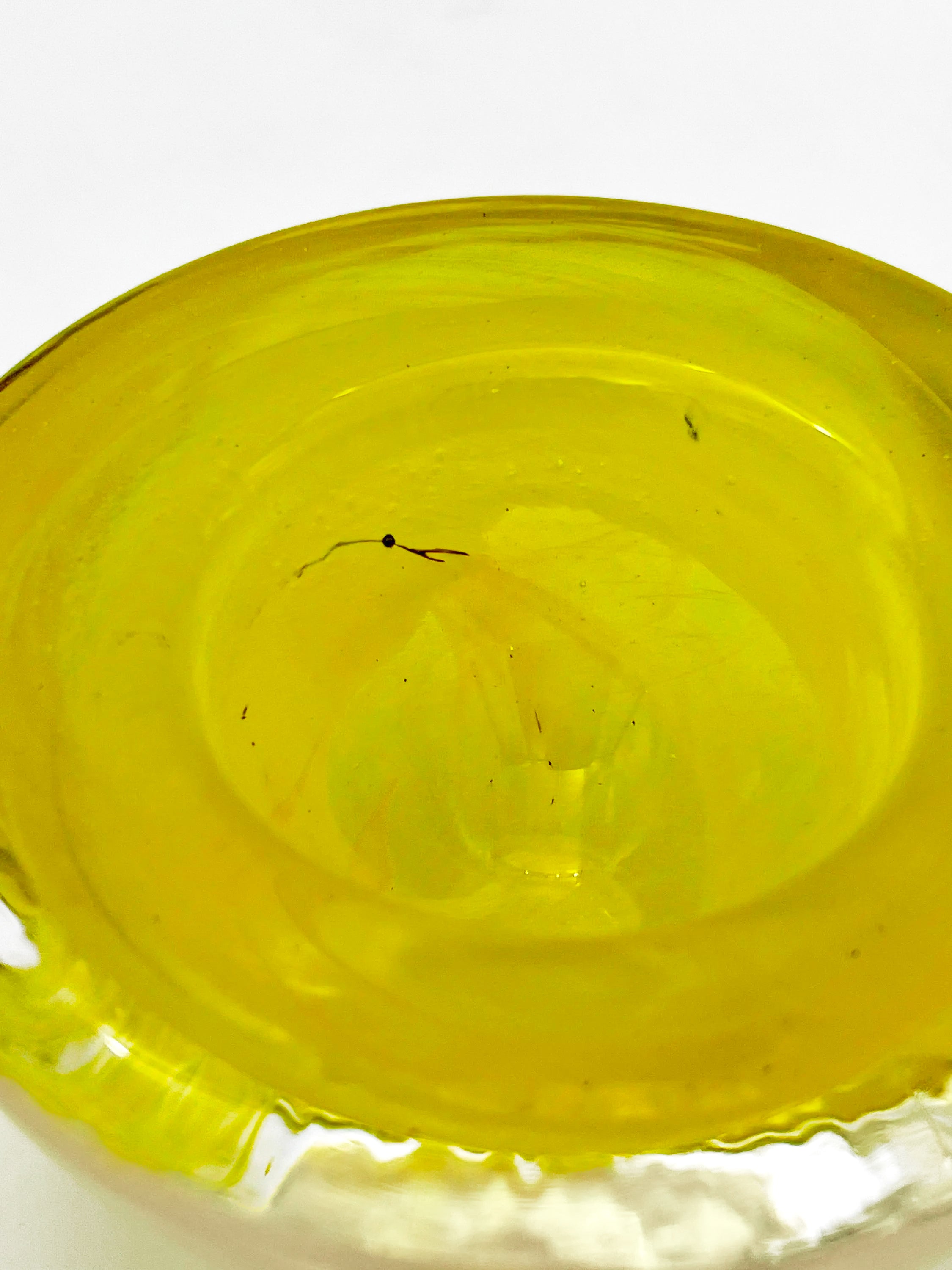 Vintage mouth-blown Kosta Boda glass tea light holder in a vibrant yellow glass.