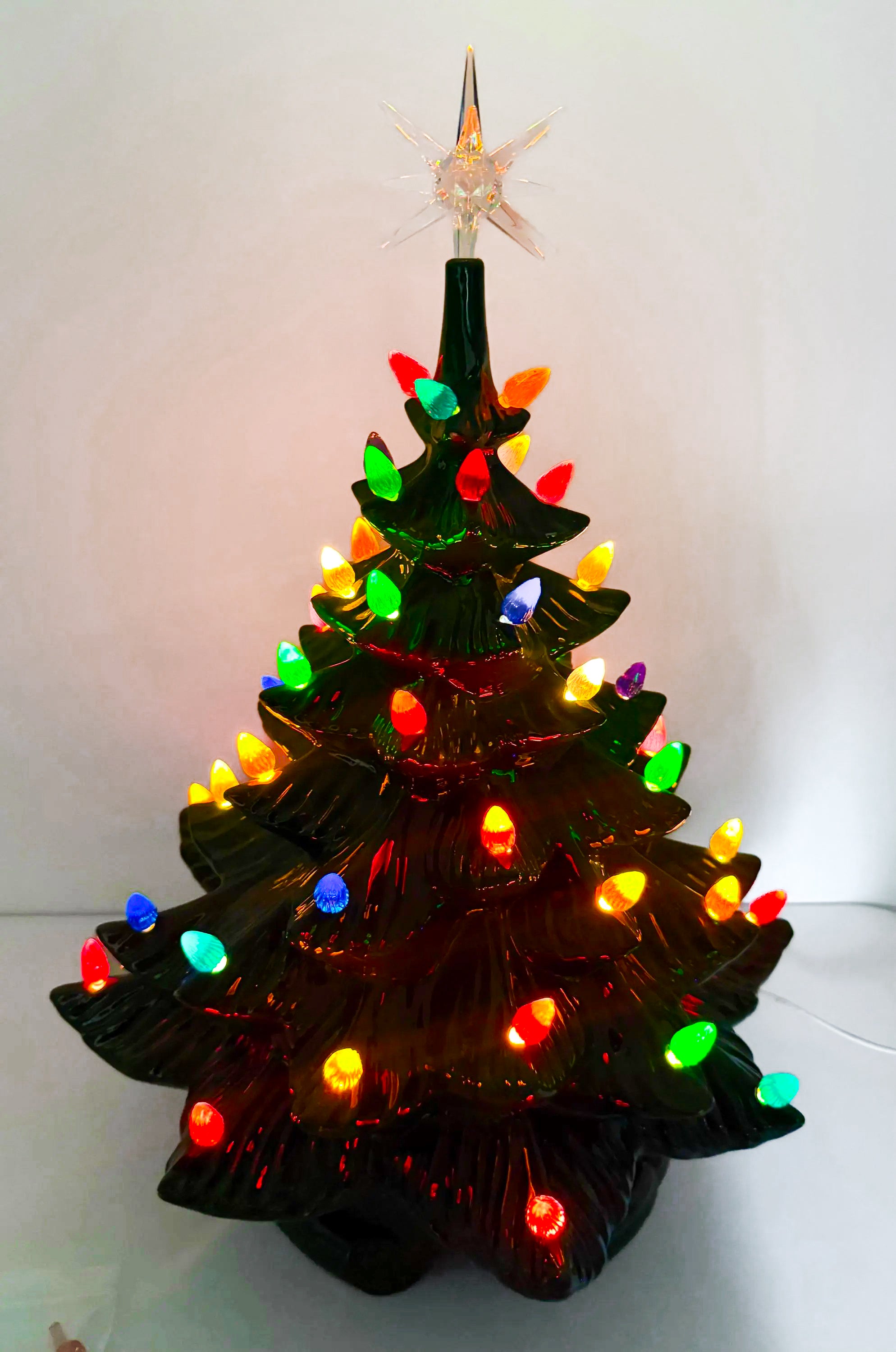 Large lighted 22-inch ceramic Christmas tree by Atlantic Mold with multicolor bulbs, star topper, and music box.