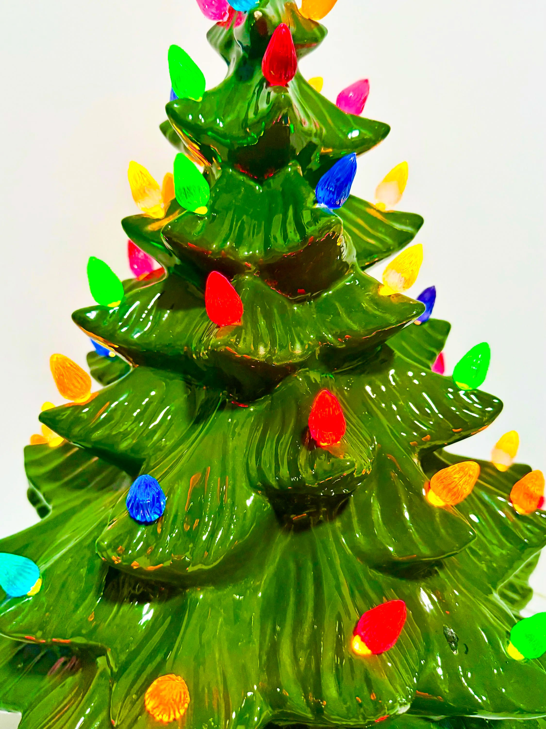 Large lighted 22-inch ceramic Christmas tree by Atlantic Mold with multicolor bulbs, star topper, and music box.
