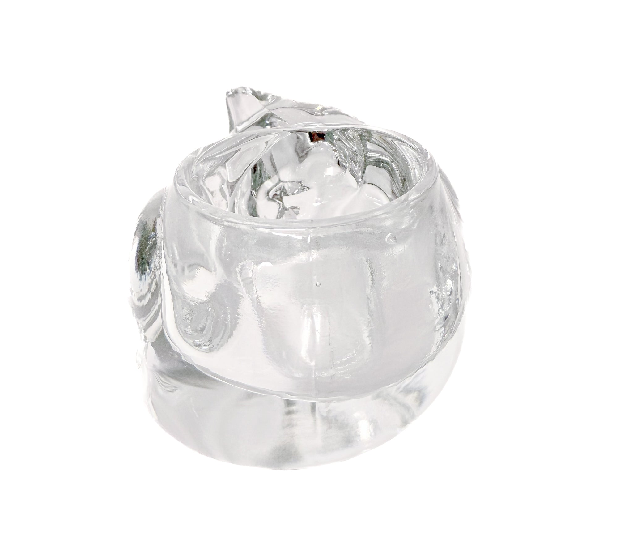 Clear molded glass votive holder shaped like a sleeping cat, vintage Indiana Glass.