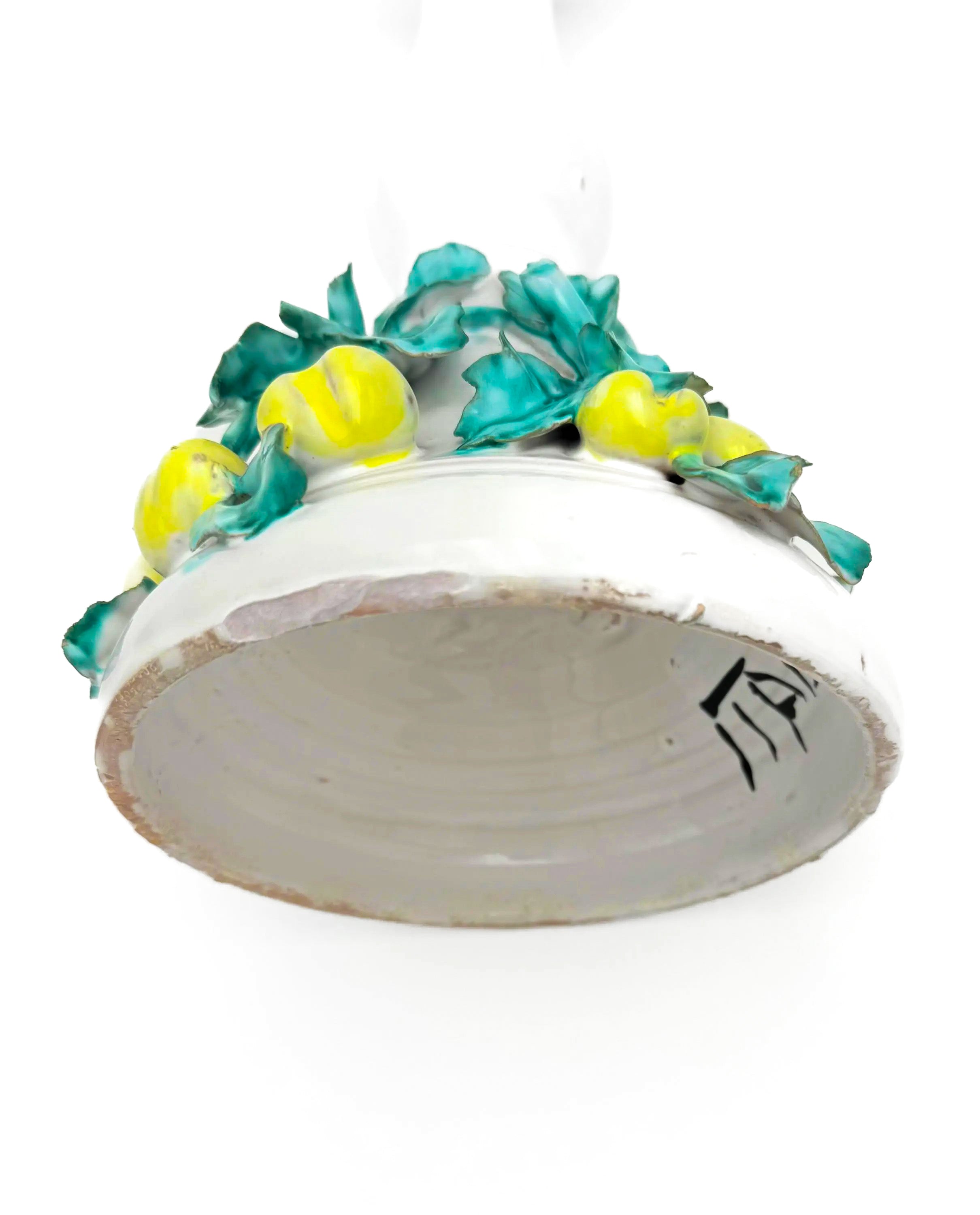 Tall vintage Italian ceramic candlestick featuring a colorful 3D fruit and leaf motif.
