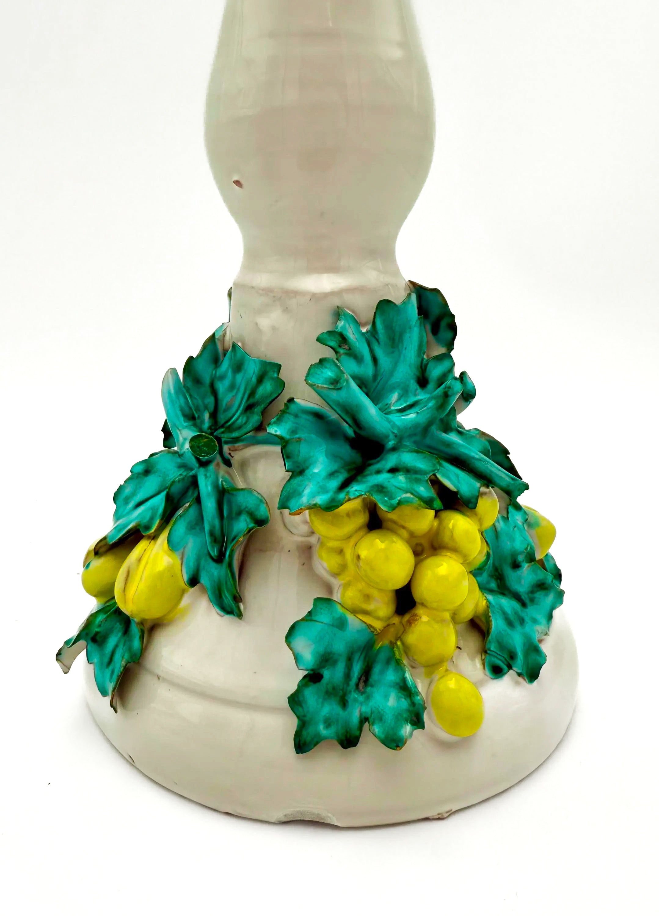 Tall vintage Italian ceramic candlestick featuring a colorful 3D fruit and leaf motif.