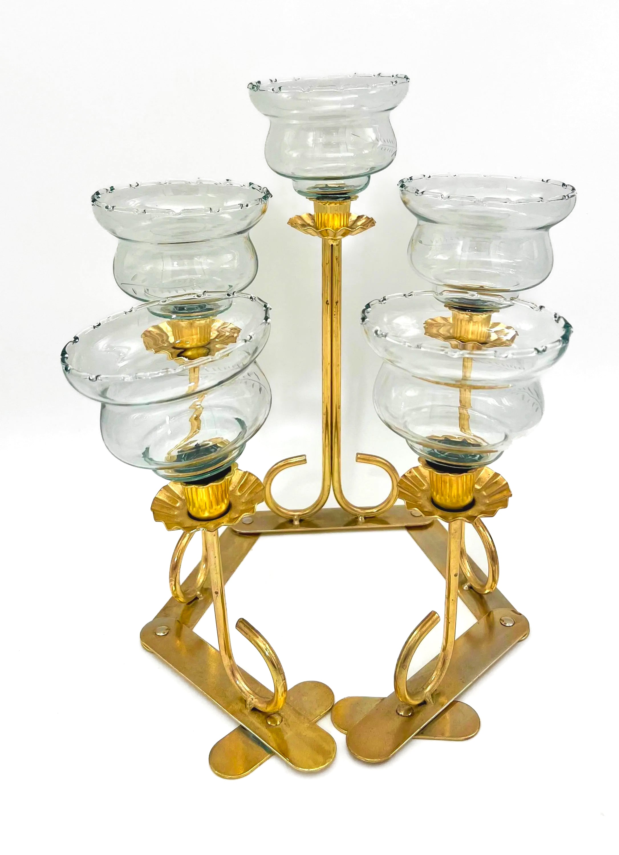 Mid-century solid brass candelabra with adjustable arms for custom candle positioning.