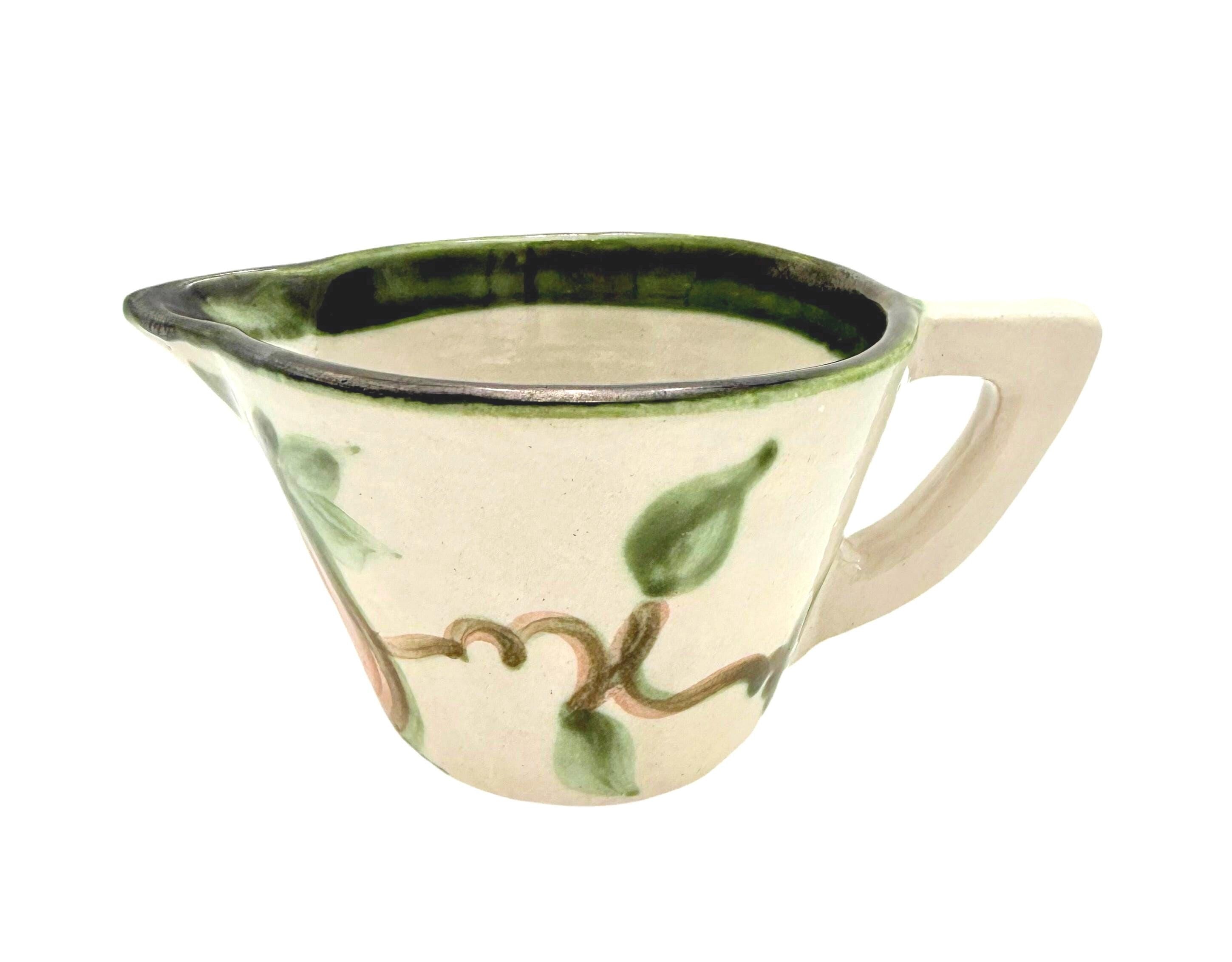 Vintage 1950s John B. Taylor Harvest pattern ceramic creamer with raised fruit and leaf motif.