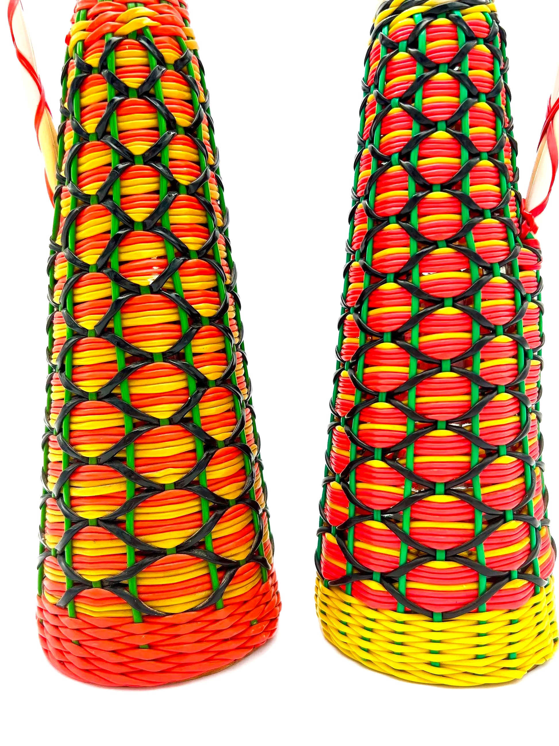 Spanish vintage decanter wrapped in colorful 1960s boho Scoubidou woven plastic webbing.