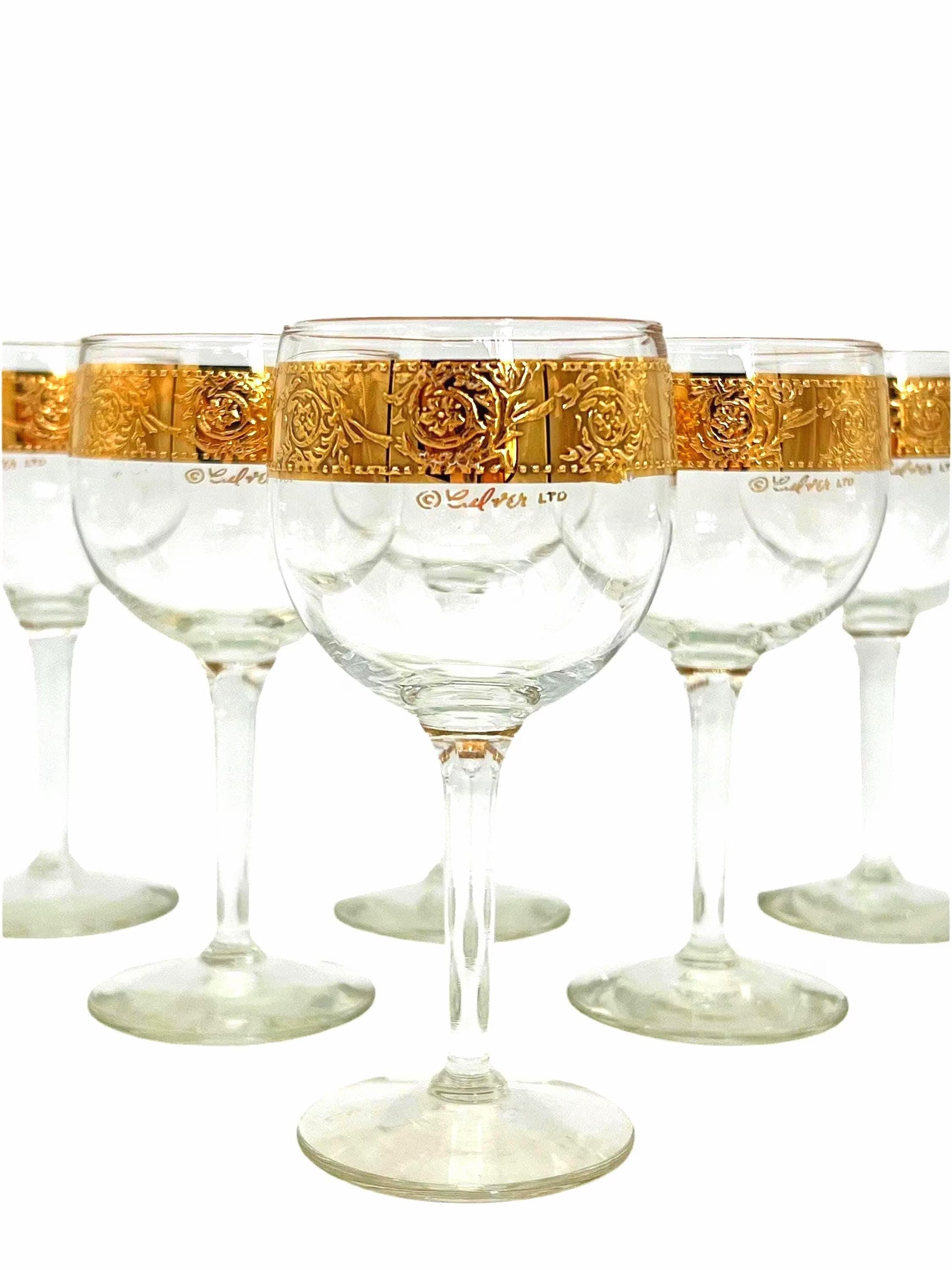 Set of 6 vintage Culver Tyrol wine glasses featuring 22k gold encrusted textured bands on clear glass stems.