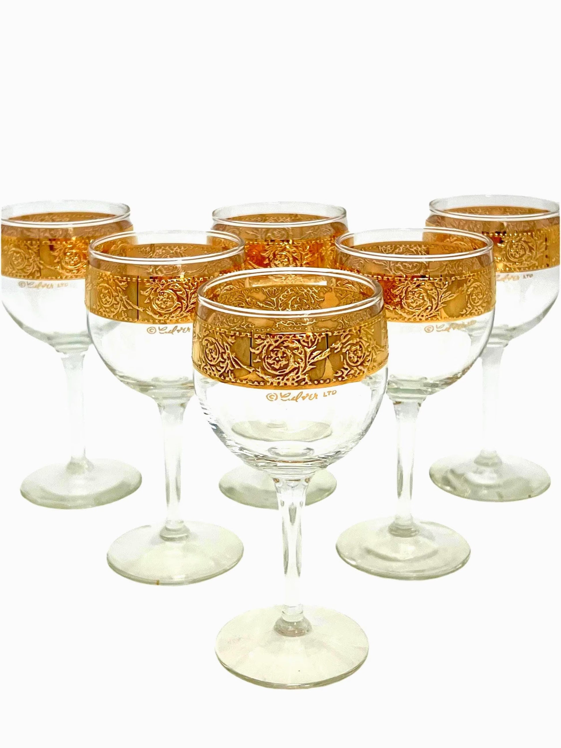 Set of 6 vintage Culver Tyrol wine glasses featuring 22k gold encrusted textured bands on clear glass stems.