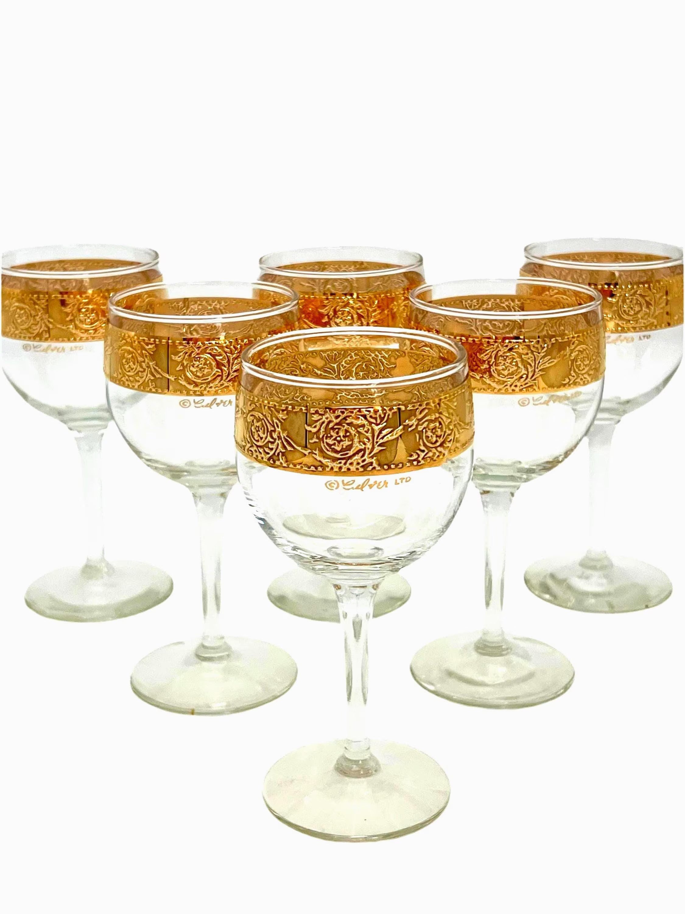Set of 6 vintage Culver Tyrol wine glasses featuring 22k gold encrusted textured bands on clear glass stems.