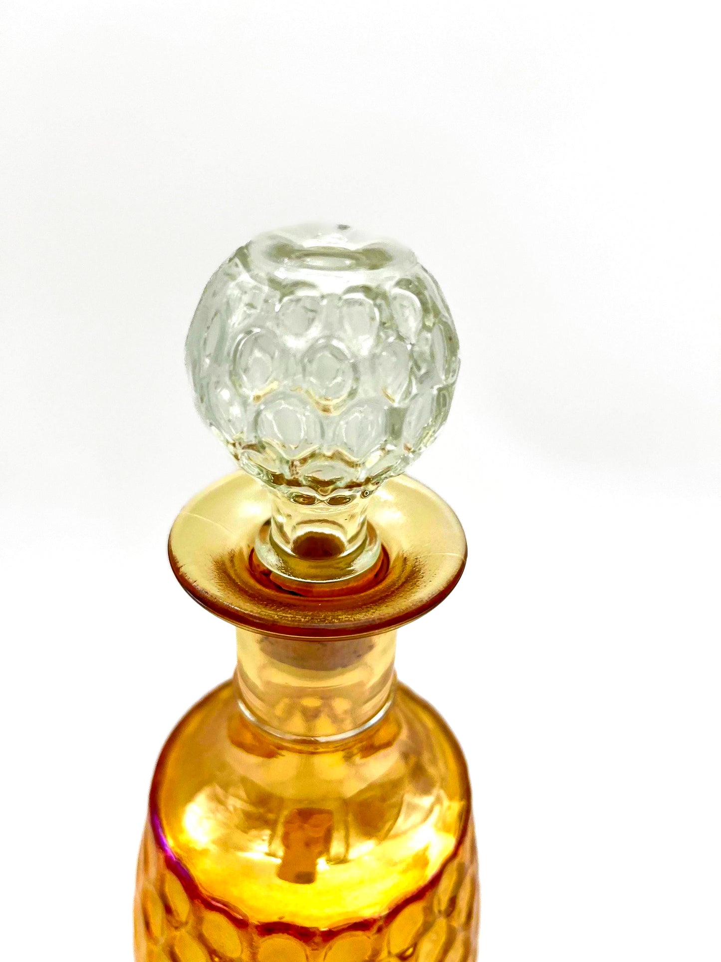 Vintage 1960s Old Forester whisky decanter in iridescent carnival glass with a textured geometric pattern.