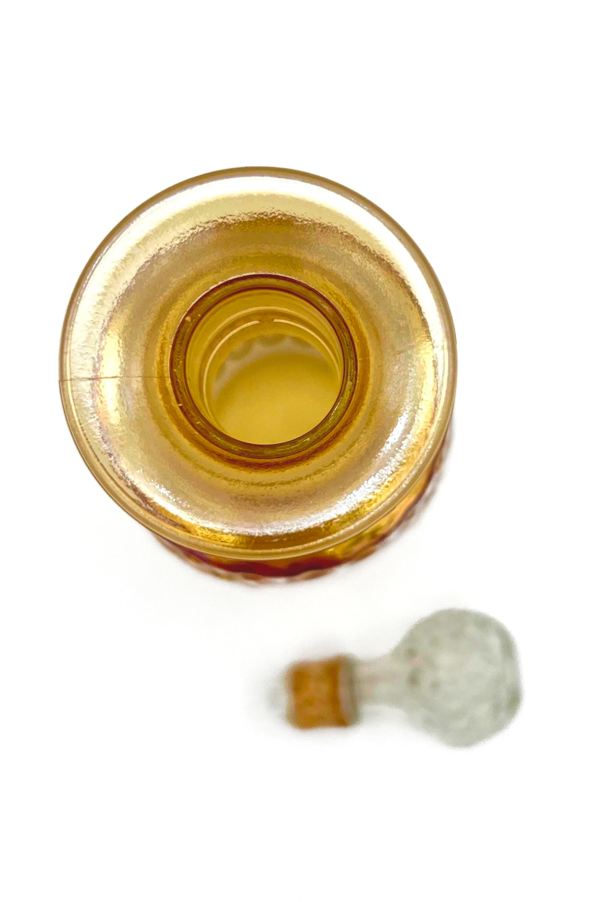 Vintage 1960s Old Forester whisky decanter in iridescent carnival glass with a textured geometric pattern.