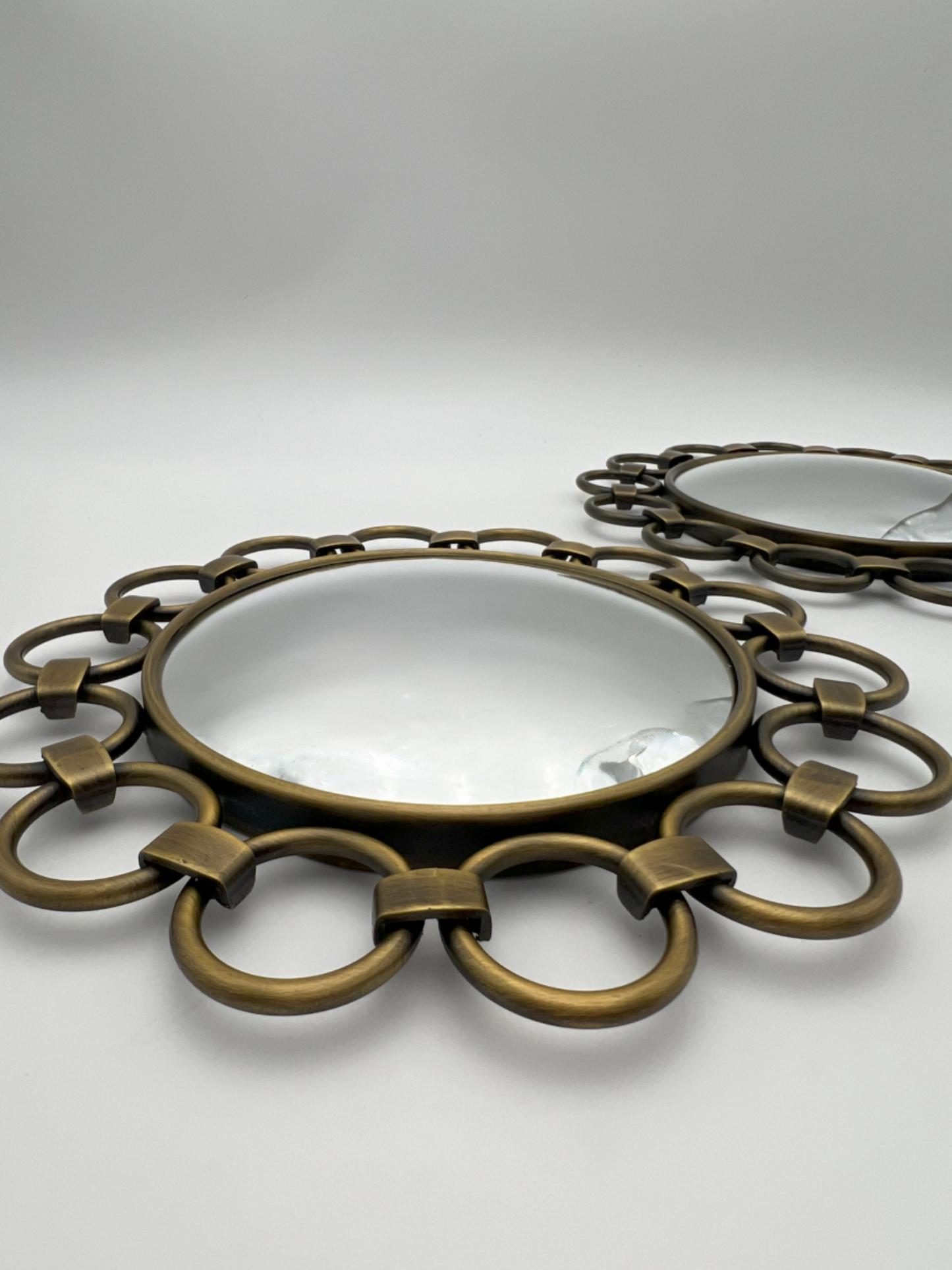 VINTAGE PAIR OF VICTORIA HAGAN CIRCULAR BRASS MIRRORS