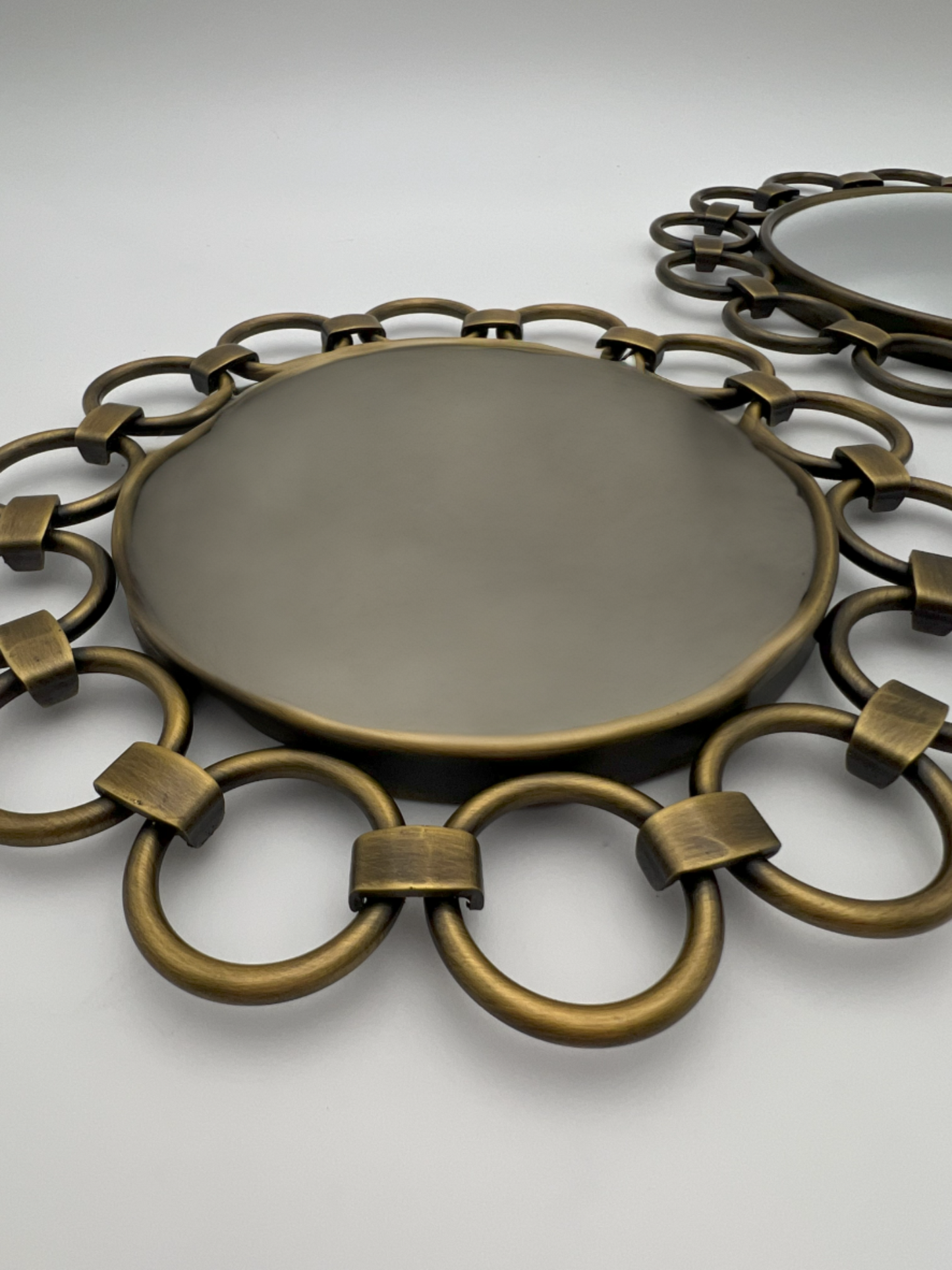 VINTAGE PAIR OF VICTORIA HAGAN CIRCULAR BRASS MIRRORS