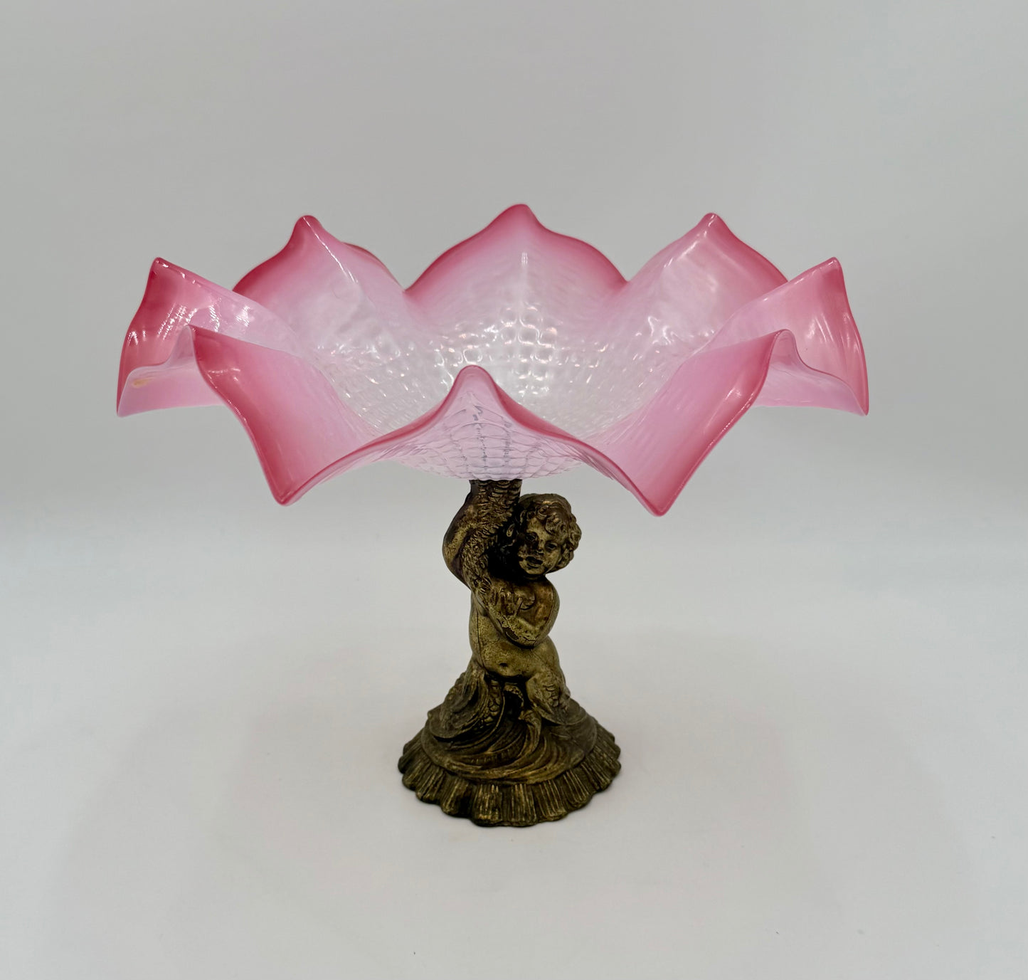ANTIQUE CRANBERRY ART GLASS COMPOTE WITH CHERUB BASE – VICTORIAN RUFFLED EDGE BOWL – 9” TALL × 11.5” DIAMETER – CIRCA 1890–1910
