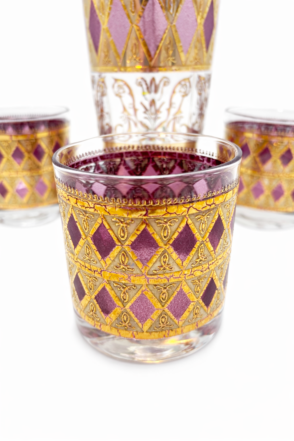 CULVER JEWELED MAGENTA AND 22K GOLD COCKTAIL SET WITH PITCHER AND STIR CIRCA 1960S